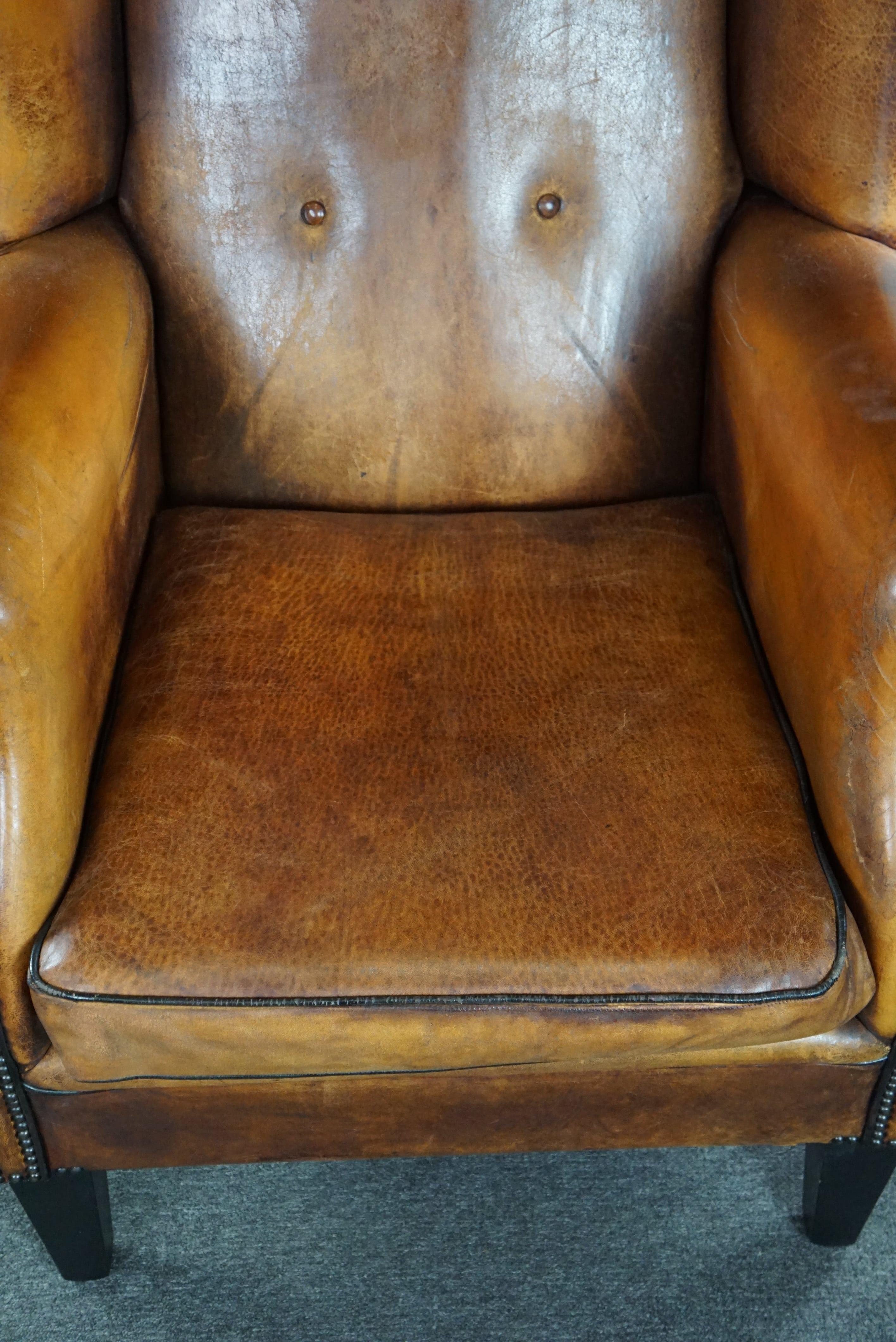 Leather Lovely large sheepskin leather wingback armchair with very good seating comfort For Sale