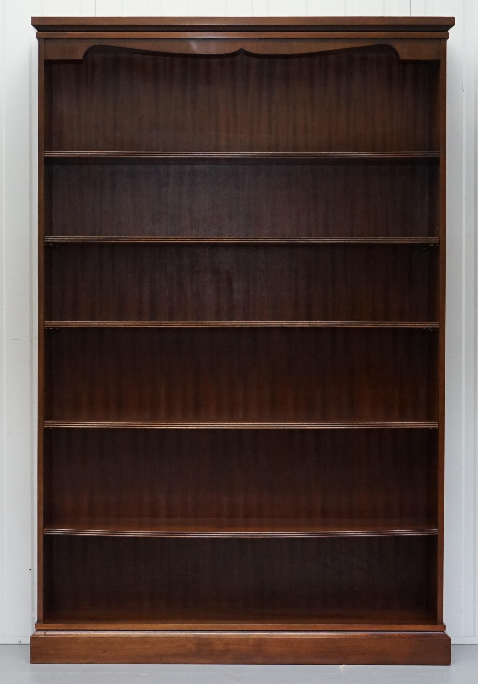 We are delighted to offer for sale this lovely large solid Flamed Mahogany Library bookcase

A good looking and versatile piece of furniture, the top is nicely carved with a flowing serpentine bend

The piece has been deep cleaned hand condition