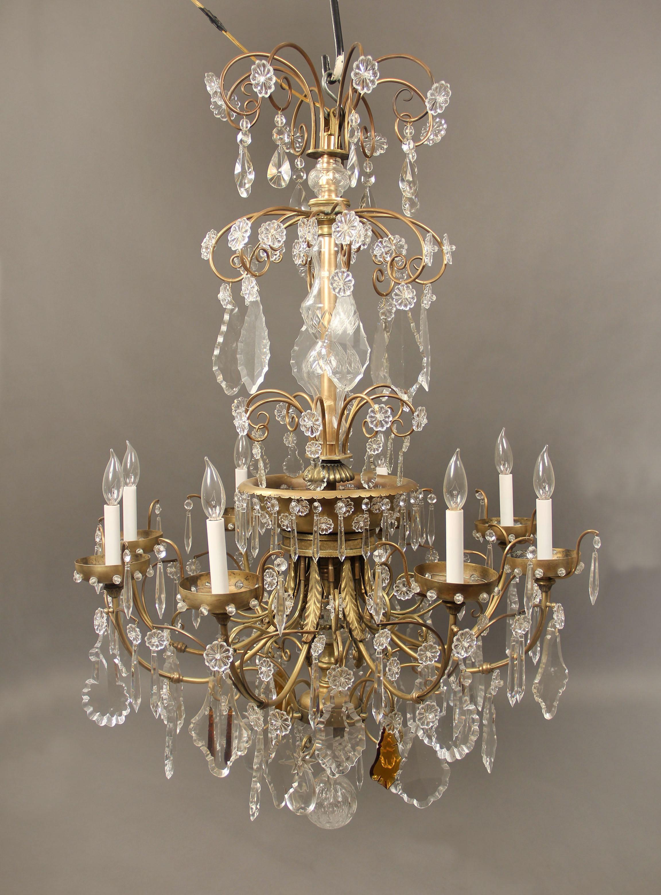 A lovely late 19th century gilt bronze and crystal eight-light chandelier.

Multi-faceted and shaped crystal with some amber, cut crystal central column, eight perimeter lights.

If you are looking for a chandelier, a lantern or sets of sconces,
