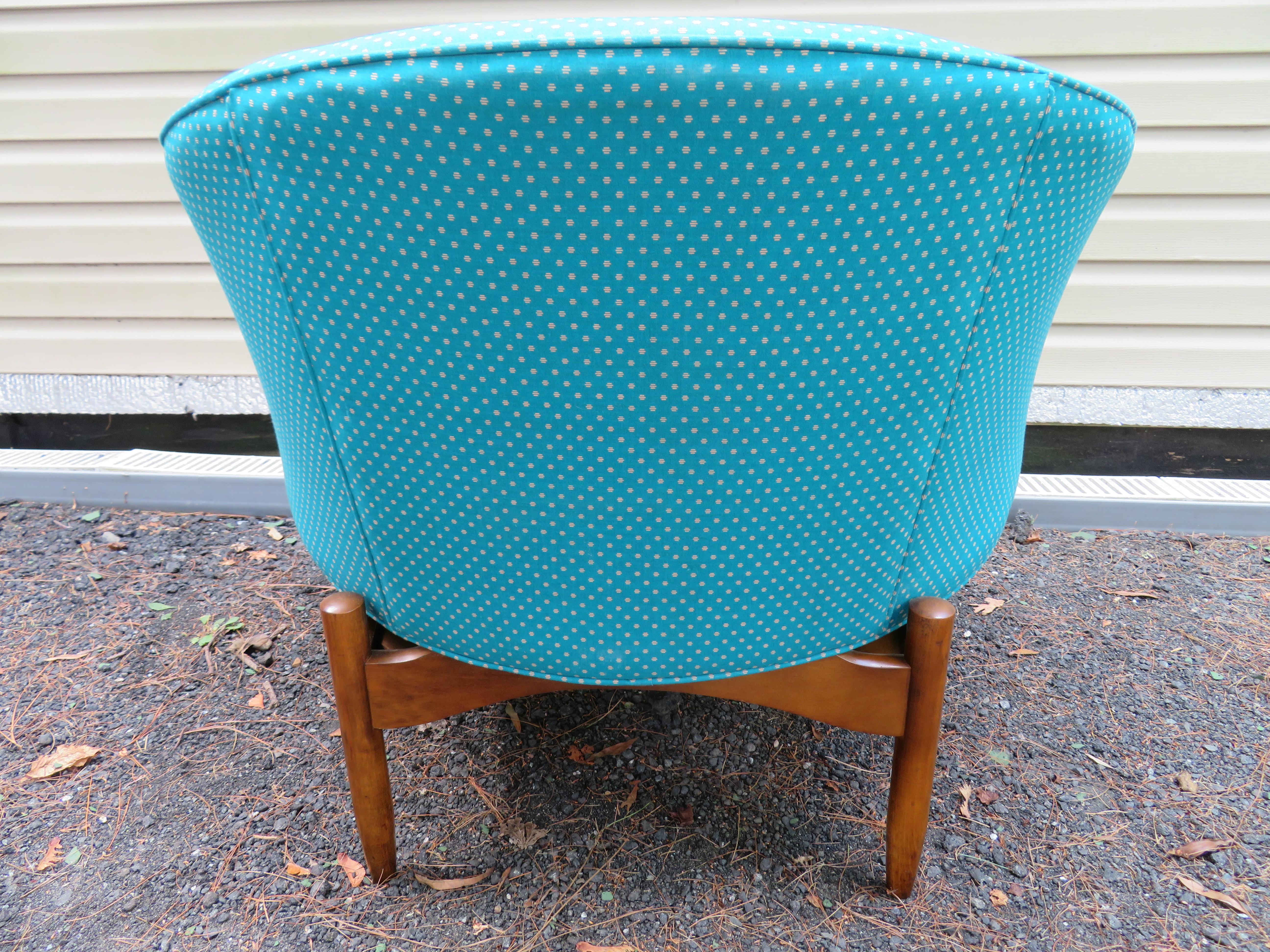 Very uncommonly seen club chair designed by Lawrence Peabody. This is a great wide comfortable lounge chair, circa 1960s. It features a sculptural walnut base and Classic barrel back tub chair design. The chair is structurally sound but needs to be