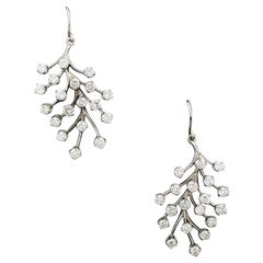 Ravissantes boucles d'oreilles cuir en or blanc et diamants