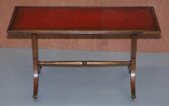 Lovely Light Mahogany with Oxblood Leather Top Coffee Table Lion Paw Castors