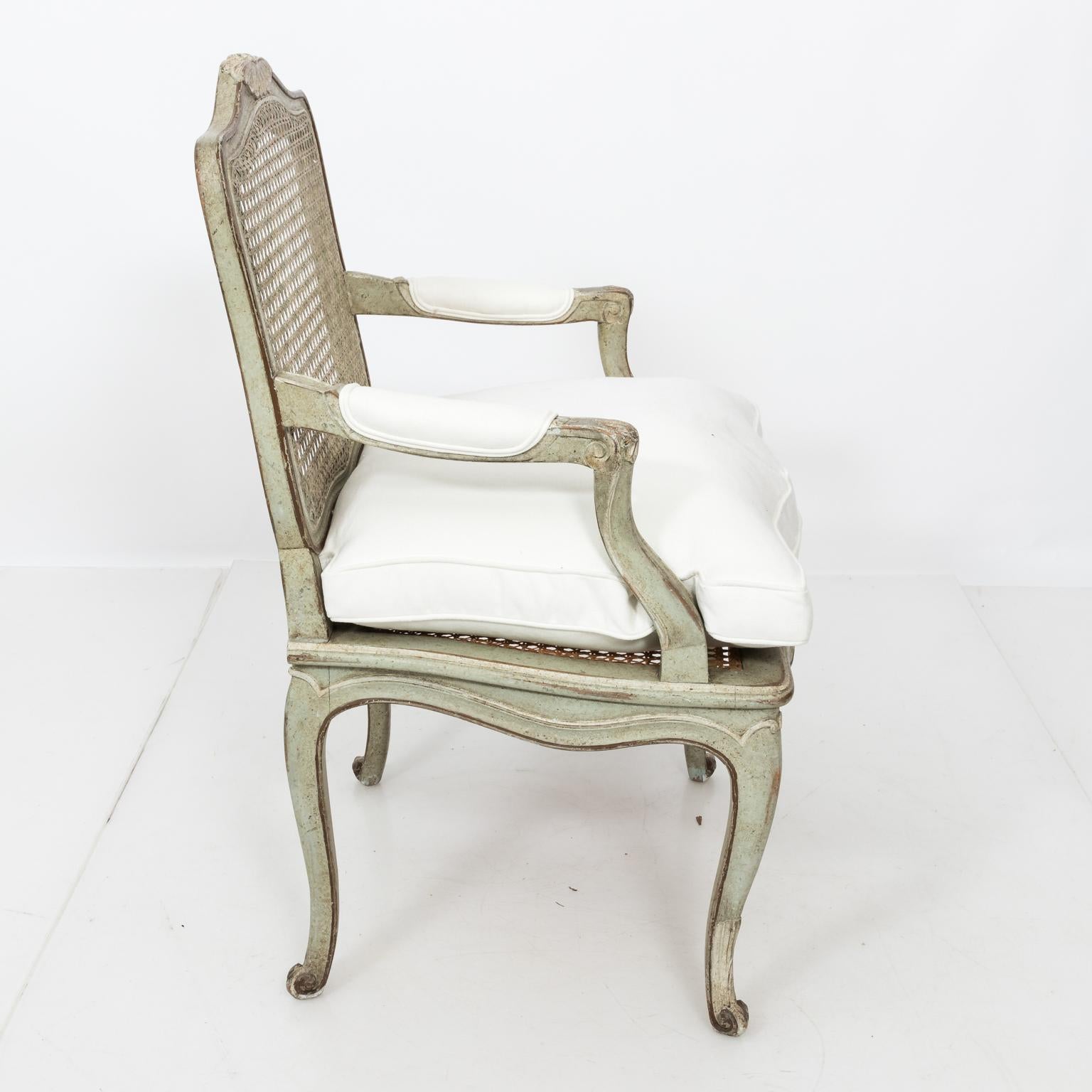 Lovely Louis XVI cane back fauteuil with newly upholstered cream cushion.
 