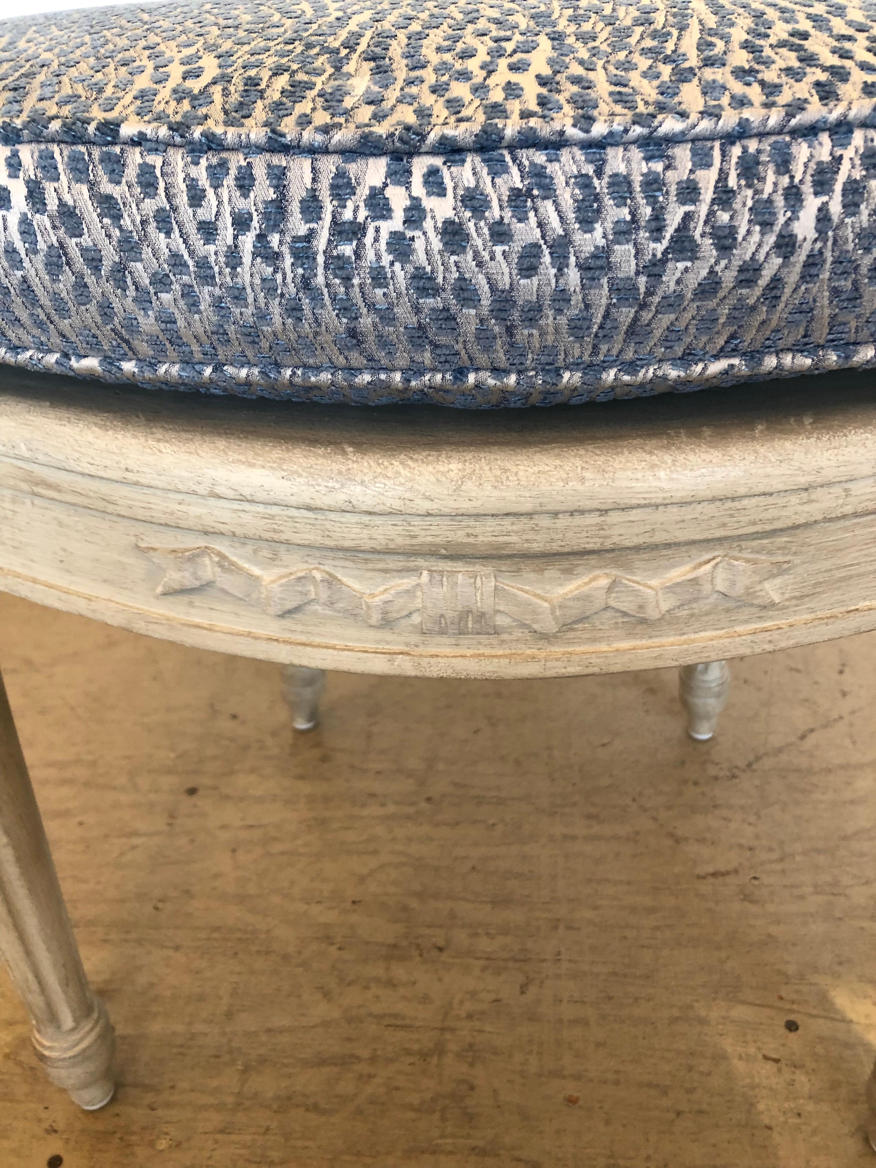 Lovely carved wood creamy white painted side chair having caning on the seat and oval back and stylish updated custom seat cushion.