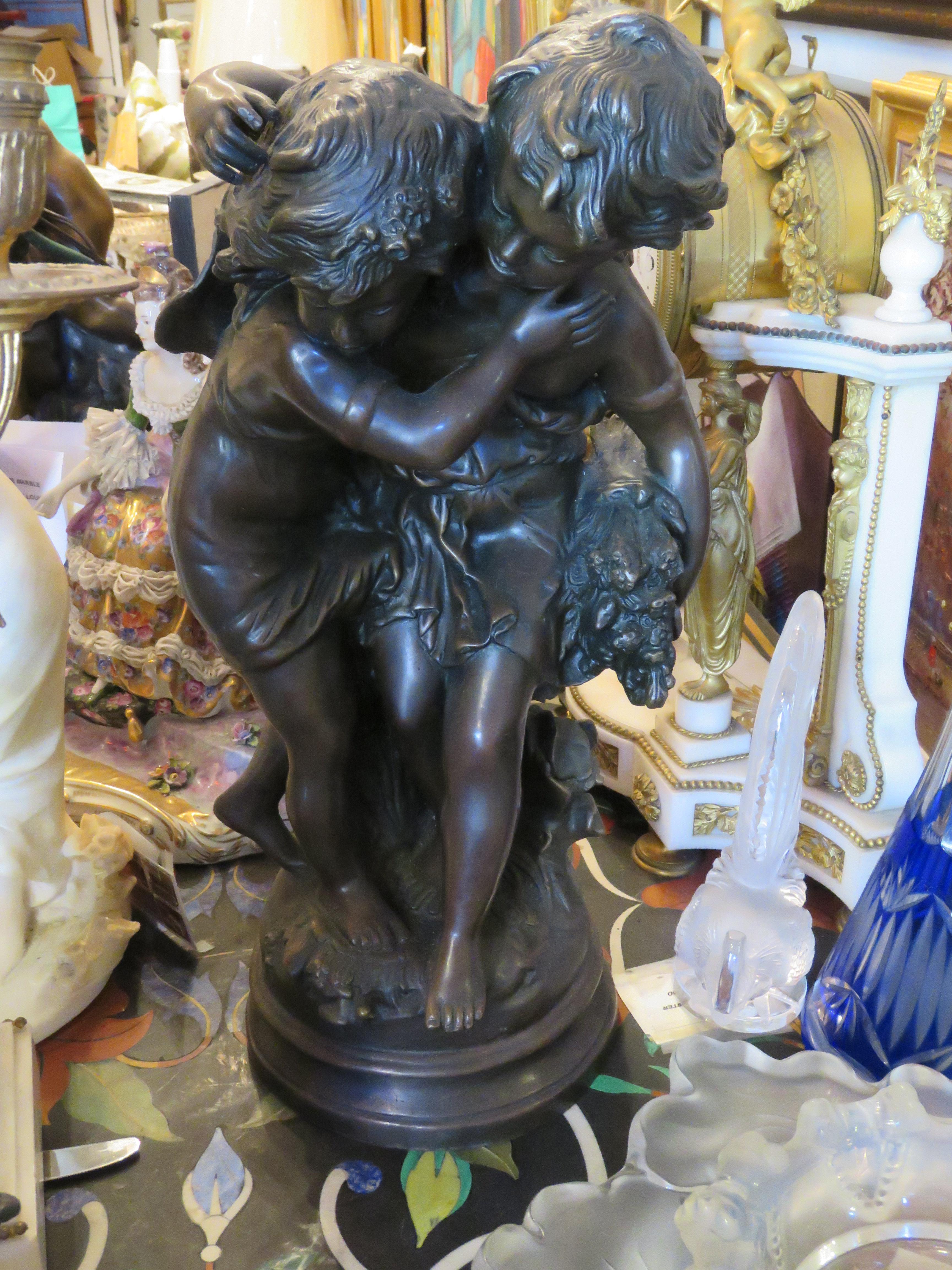 An Exquisite and Beautiful Quality Bronze of a Young Girl and Boy Embracing and Holding each other. An Outstanding Masterpiece!!  Taken from a Several Million Dollar Private New York City Estate. A Rare Beauty!!!

Measurements: 18