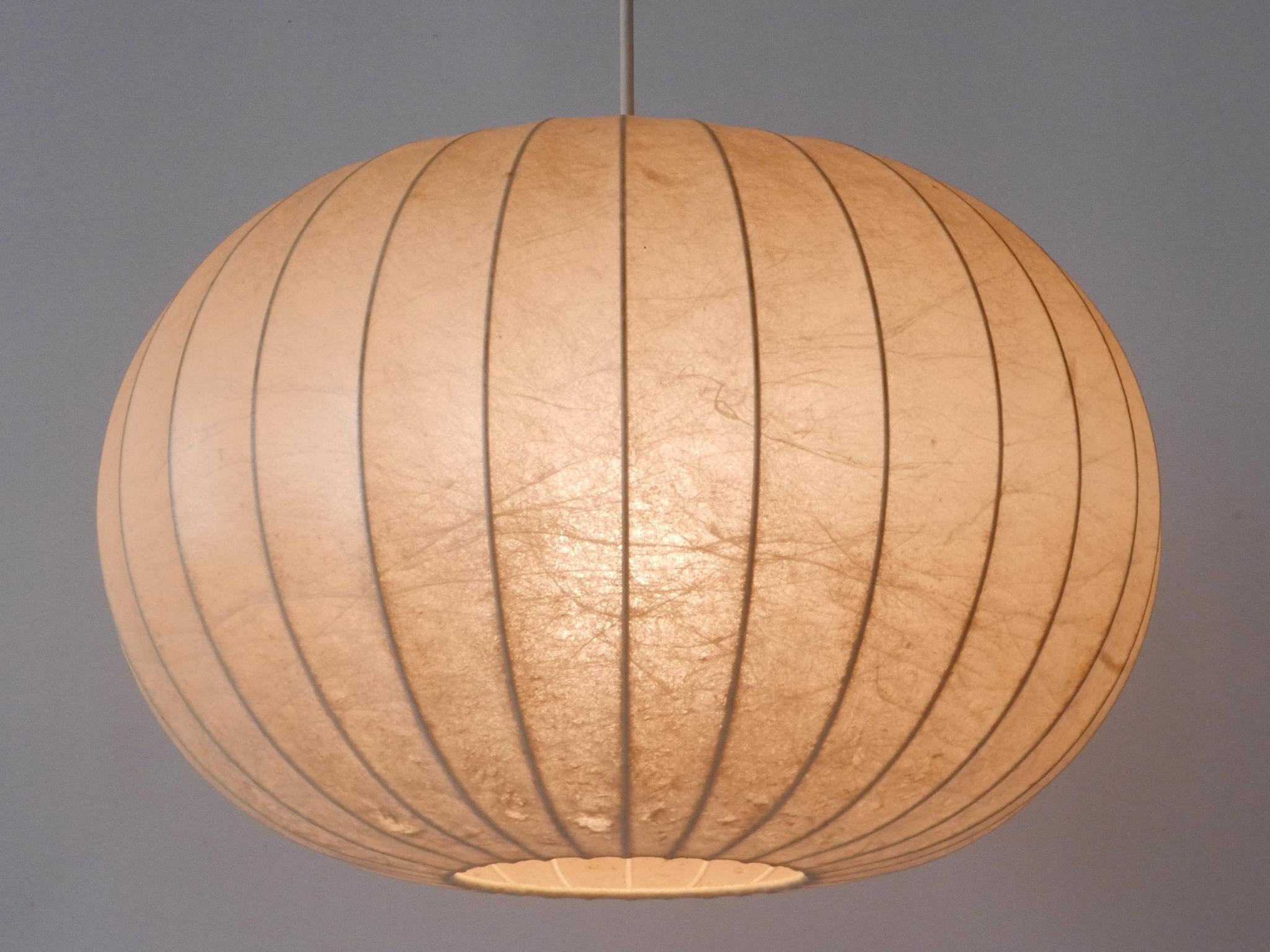 Elegant and highly decorative Mid-Century Modern cocoon pendant lamp or hanging light. Designed & manufactured probably by Goldkant Leuchten, Germany, 1960s.

Executed in sprayed latex material and metal, the pendant lamp needs 1 x E27 / E26