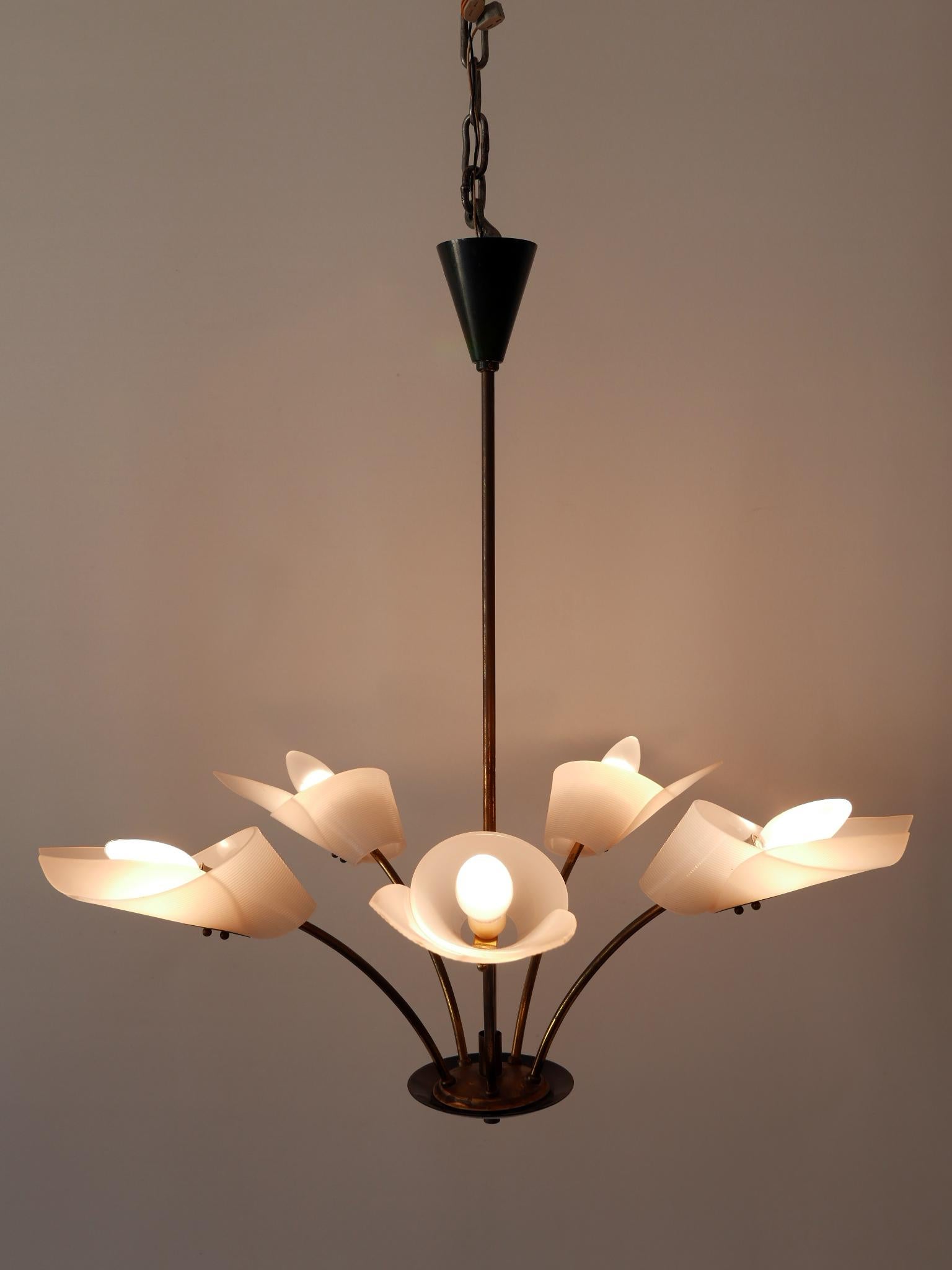 Gorgeous, highly decorative Mid-Century Modern five-armed chandelier or pendant lamp. Designed & manufactured in Germany, 1950s.

Executed in brass and acrylic glass, the pendant lamp/chandelier needs 5 x E14 / E12 Edison screw fit bulbs. It is