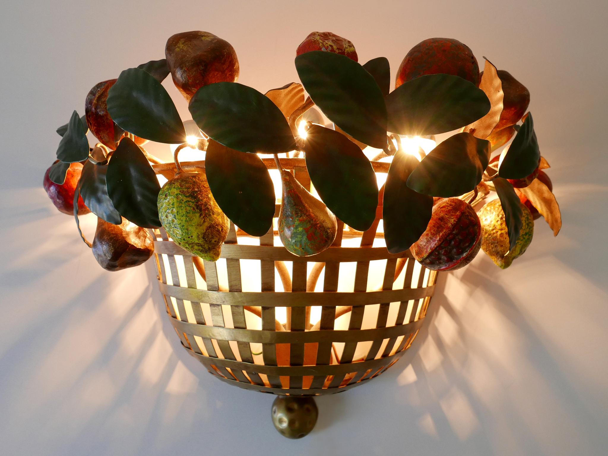 Rare, amazing and highly decorative Mid-Century Modern five-flamed wall fixture or sconce 'fruit basket'. Designed and manufactured by Lucienne Monique, Scandicci (Firenze), Italy, 1960s. Manufacturers label reverse.

Executed in metal, the wall