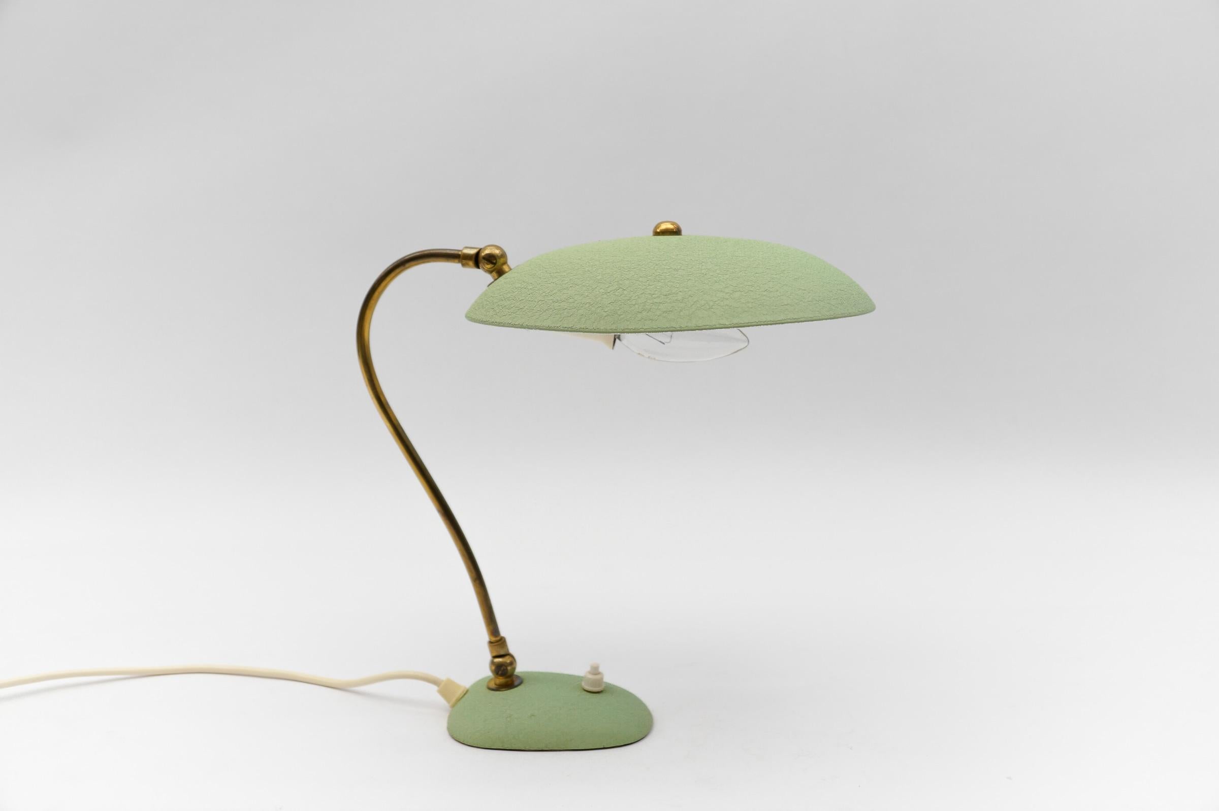 Lovely Mid-Century Modern Table Lamp in Brass, 1950s

Dimension
Height: 11.81 in (30 cm)
Width: 9.05 in (23 cm)
Depth: 18.50 in (47 cm)

The lamp needs 1 x E14 / E15 Edison screw fit bulb, is wired, and in working condition. It runs both on 110 /