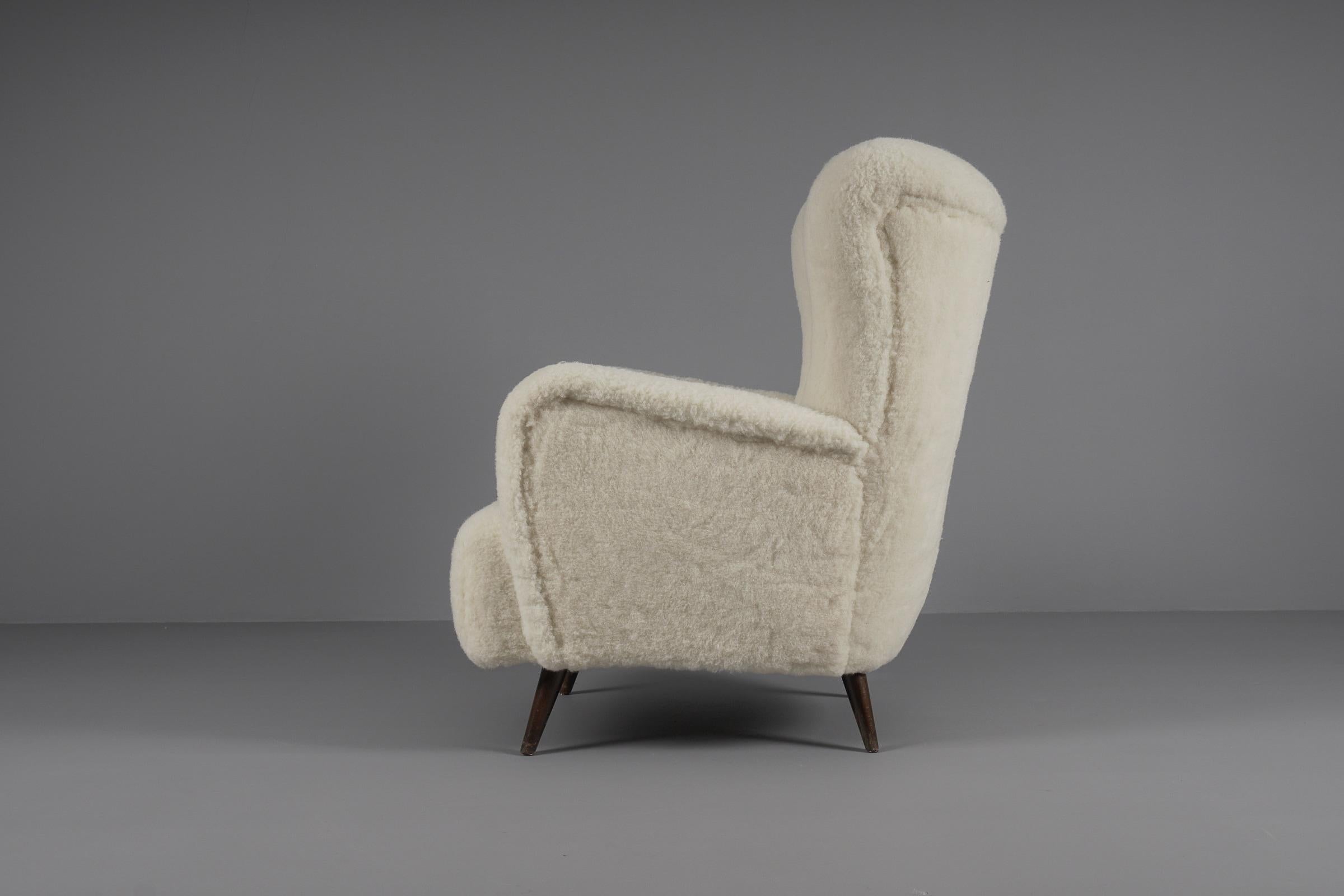 Sheepskin Lovely Mid-Century Modern Wingback Chair in sheepskin wool fabric, 1950s 