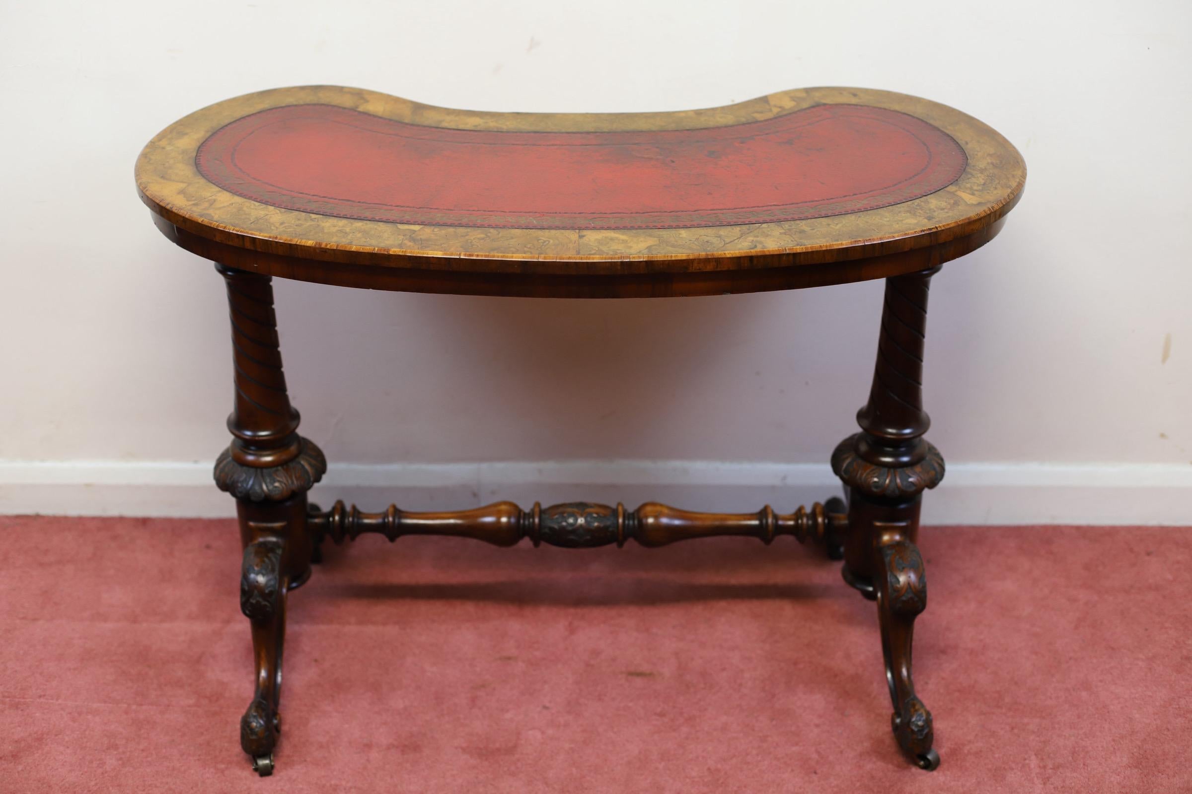 We delight to offer for sale this lovely mid-Victorian burr walnut kidney shaped stretcher table, the top inset with tooled red leather above a carved base , in amazing condition .
Don't hesitate to contact me if you have any questions.
Please have