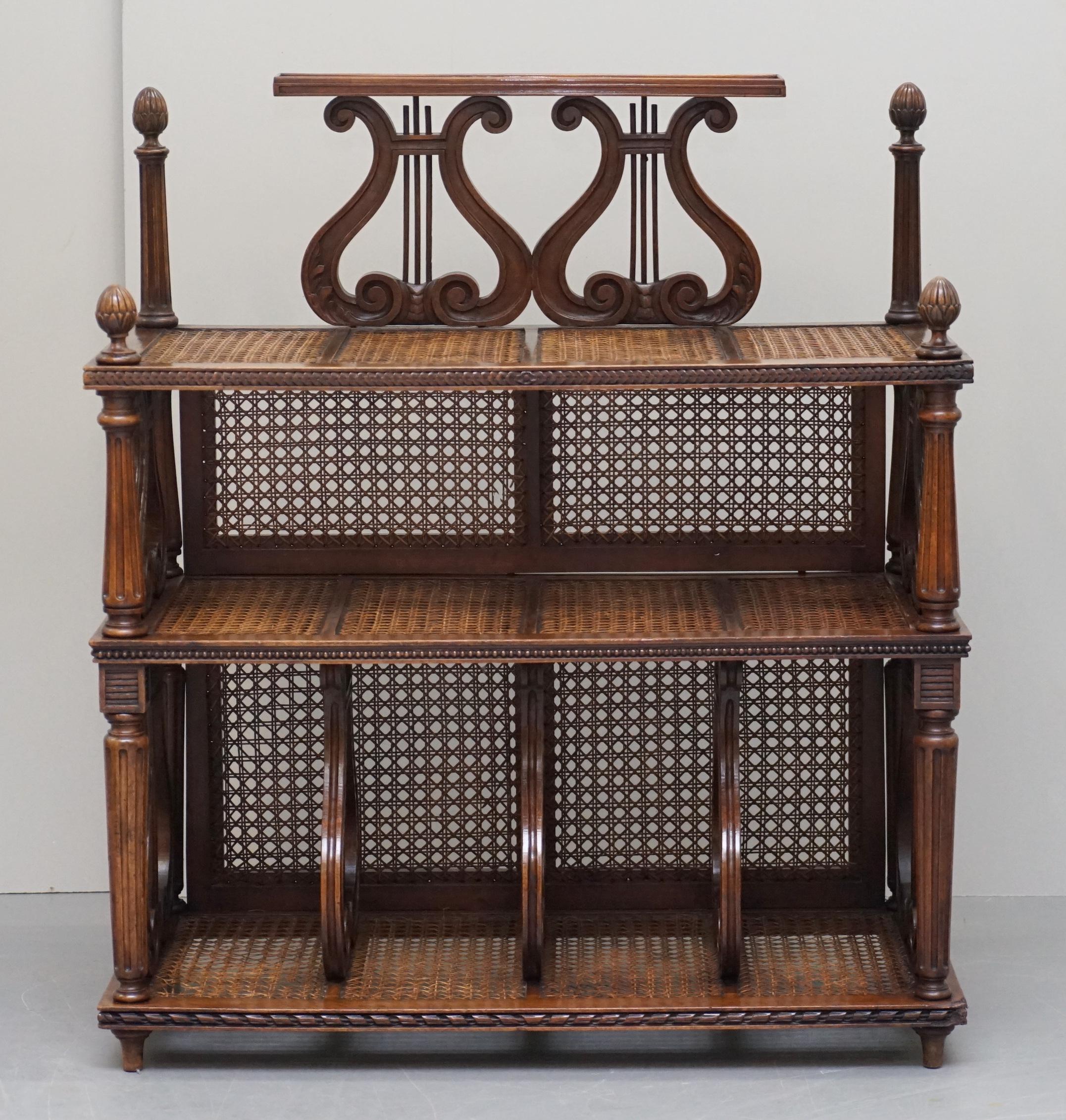 We are delighted to offer for sale this stunning original circa 1880 French walnut étagère musically inspired rattan stand or bookcase

A very unique and decorative piece of furniture. Étagère’s are similar to whatnots, you can use them for just