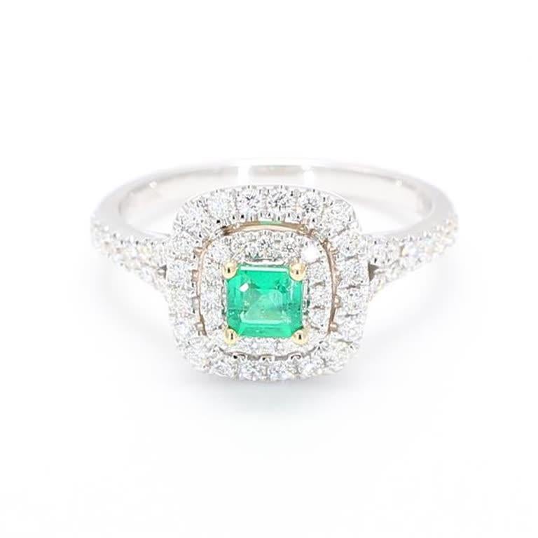 RareGemWorld's classic emerald ring. Mounted in a beautiful 18K White Gold setting with a natural emerald cut emerald. The emerald is surrounded by natural round white diamond melee. This ring is guaranteed to impress and enhance your personal
