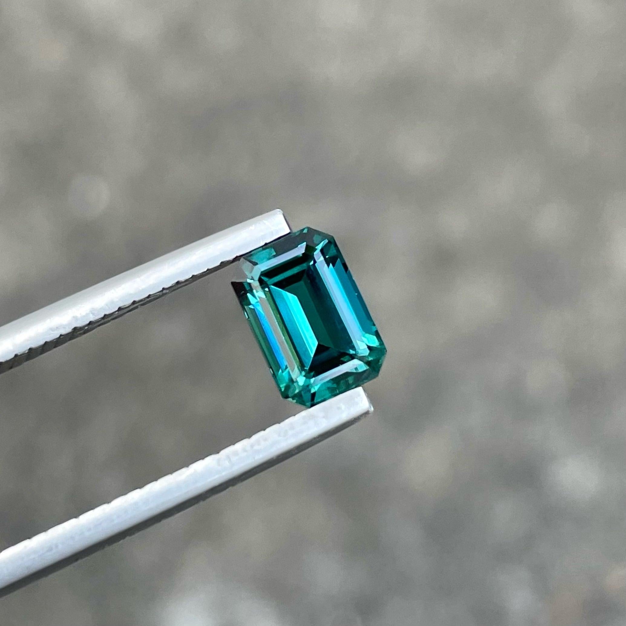 Lovely Natural Greenish Blue Tourmaline Gemstone, available for sale at wholesale price, VVS Clarity, loose gemstone, Emerald Cut, 1.50 carats certified Tourmaline from Afghanistan.

Product Information:
GEMSTONE TYPE:	Lovely Natural Greenish Blue