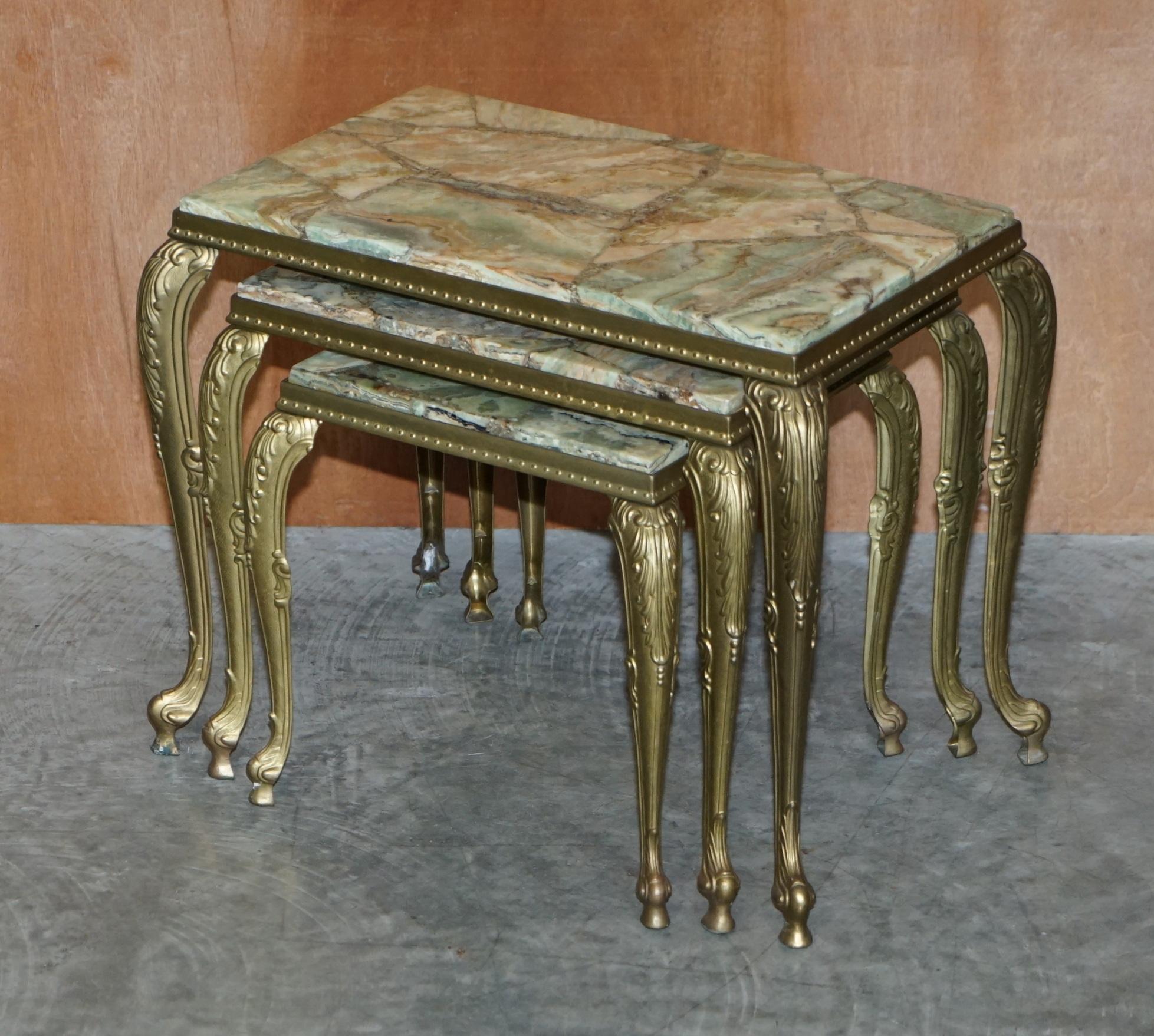 We are delighted to offer for sale this stunning vintage French circa 1940’s Brass and Onyx nest of tables 

A very good looking and well made suite. These sit well in any setting, they are very sculptural and the Onyx has a beautiful