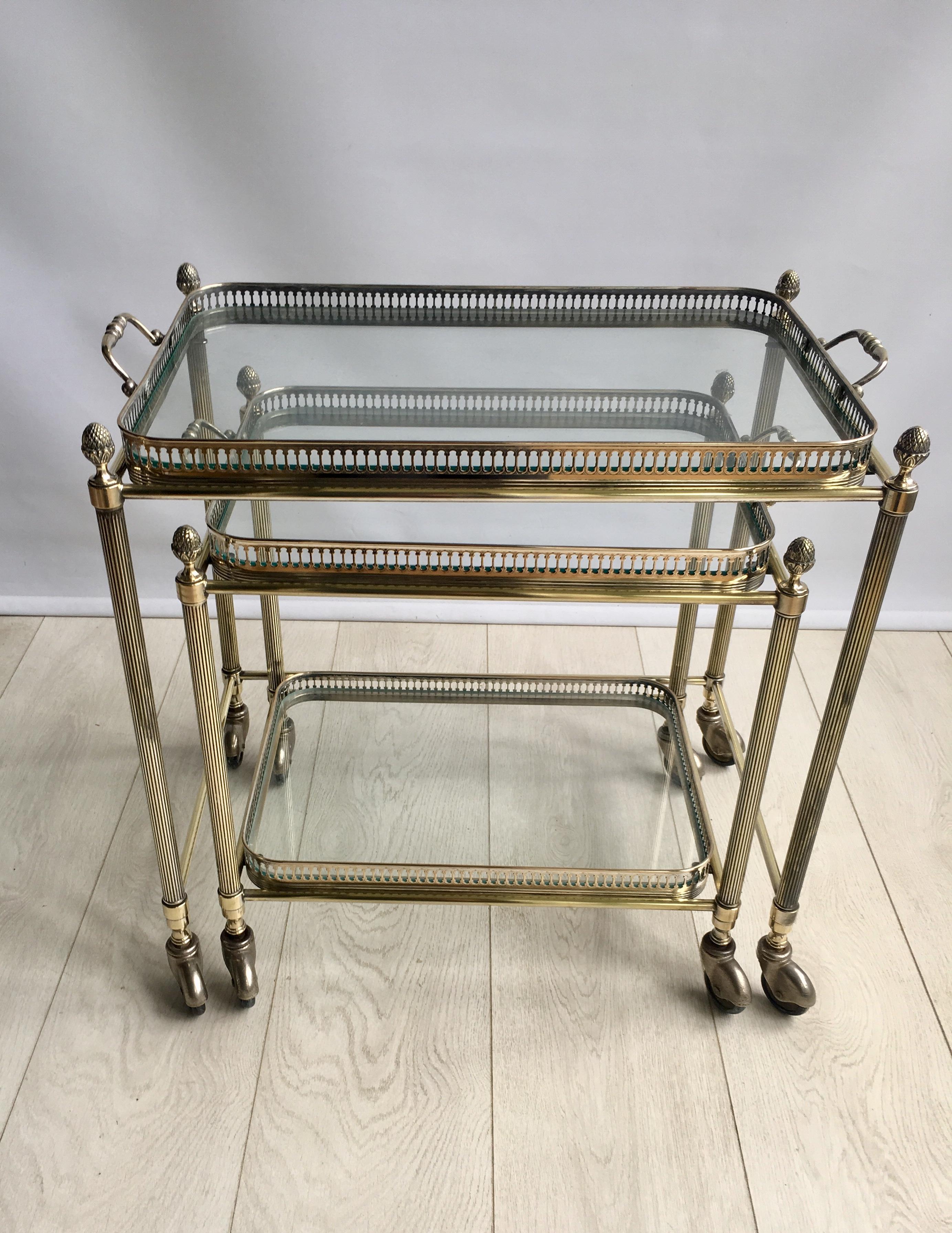 Lovely quality to this nest of two tables.

Useful pieces for the home.

The larger table top tray measures 50cm wide by 32.5cm deep, overall dims incl handles 58cm wide, 36cm deep.
Stands 50 cm to glass, 53.5 cm to handle.