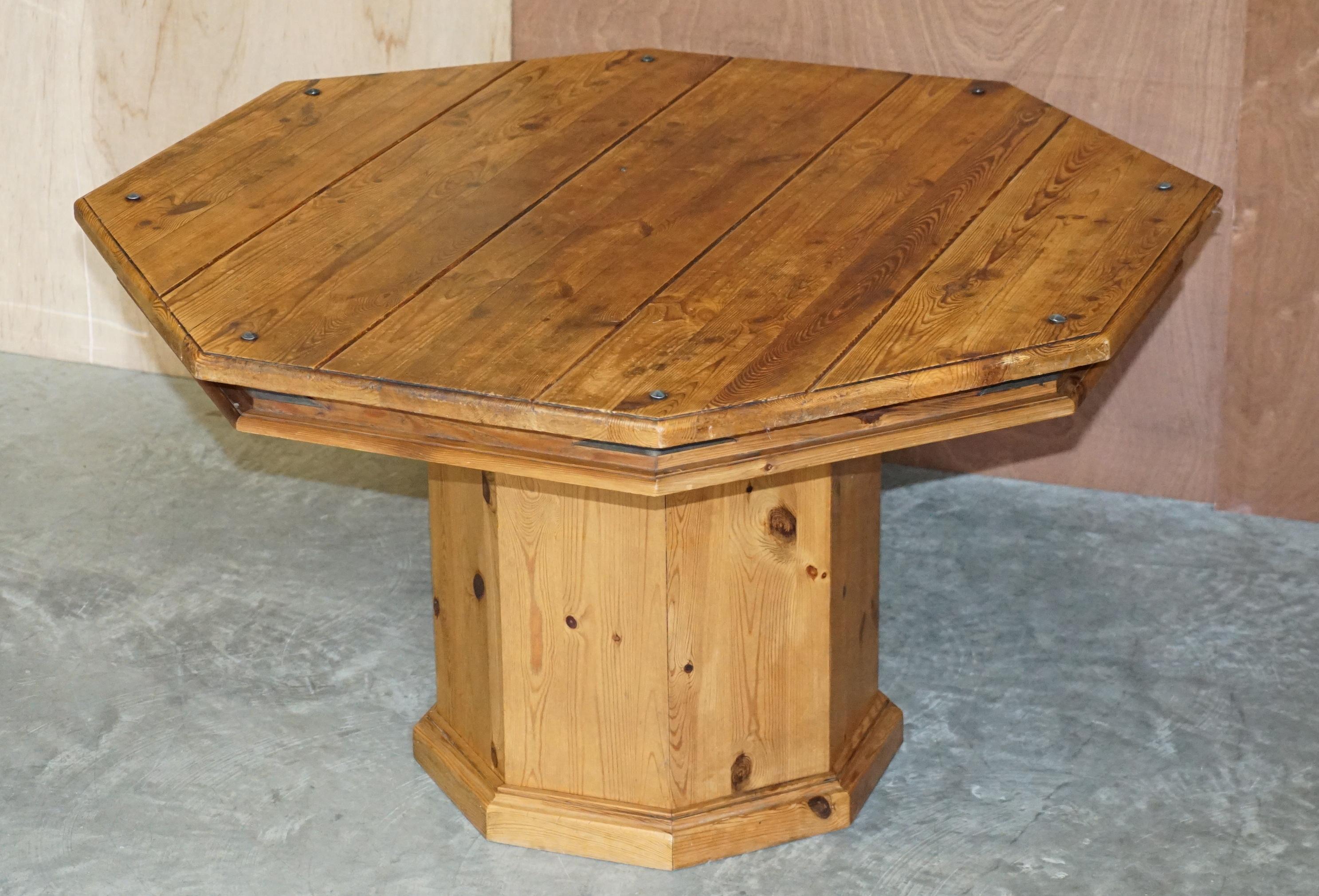 We are delighted to offer for sale this sublime vintage octagonal pine dining table with iron fixtures and fittings 

A very good looking and well made piece, it comes in two easy to transport sections, the top is one piece and the pedestal base