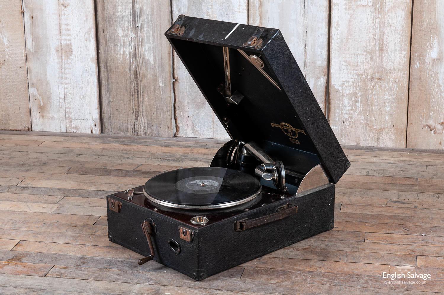 Charming old wind-up Columbia portable gramophone, a little crackly but there are new styluses with it which may improve the sound quality. It has age-related scratches, and a few knocks including a dink to the tone arm.