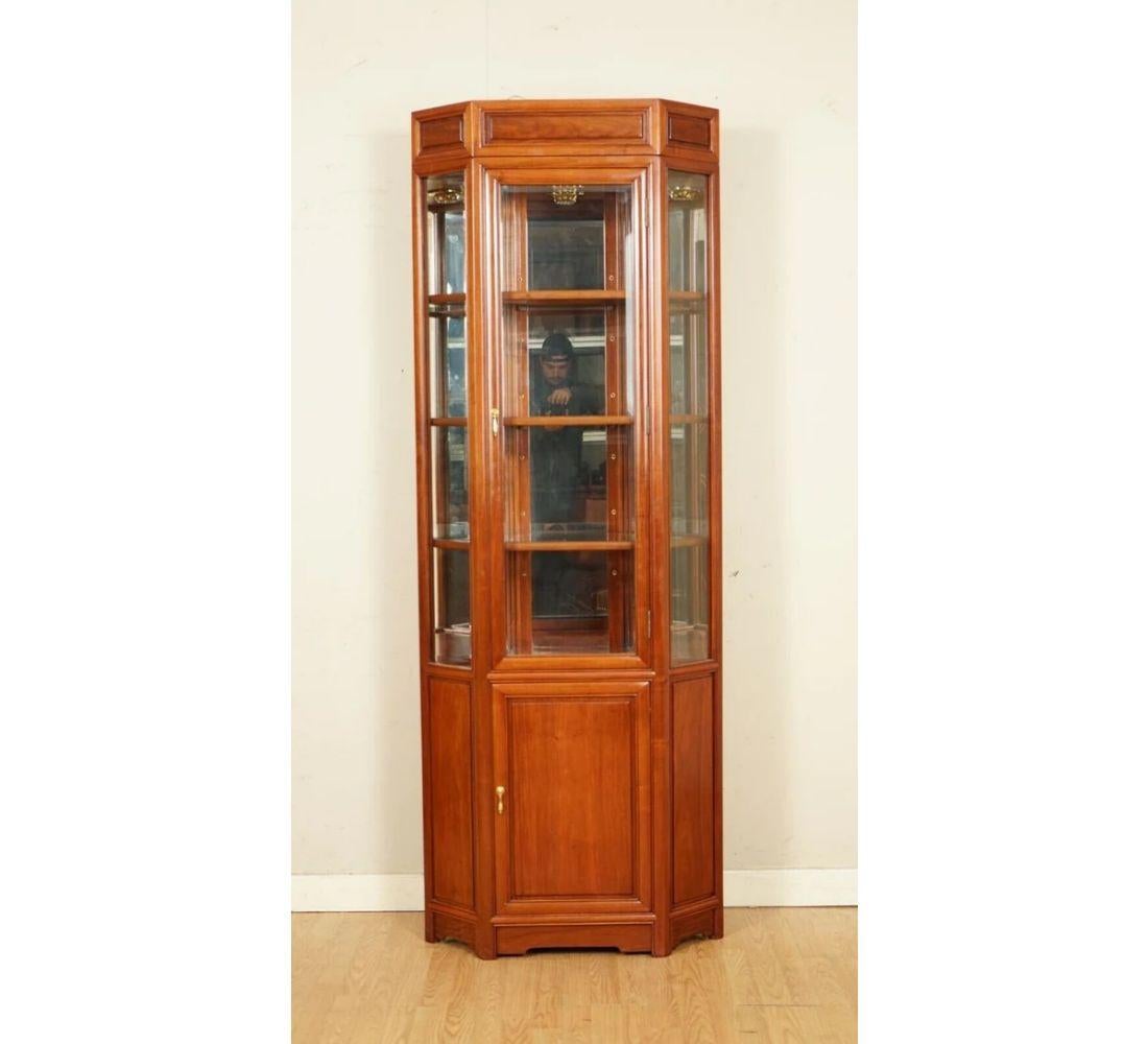 We are delighted to offer for sale this oriental Chinese hardwood corner display cabinet. 
 
We have lightly restored this by giving it a hand clean, hand waxed and hand polished.

Dimensions: 73 W x 39 D x 199 H cm 

Please carefully look at