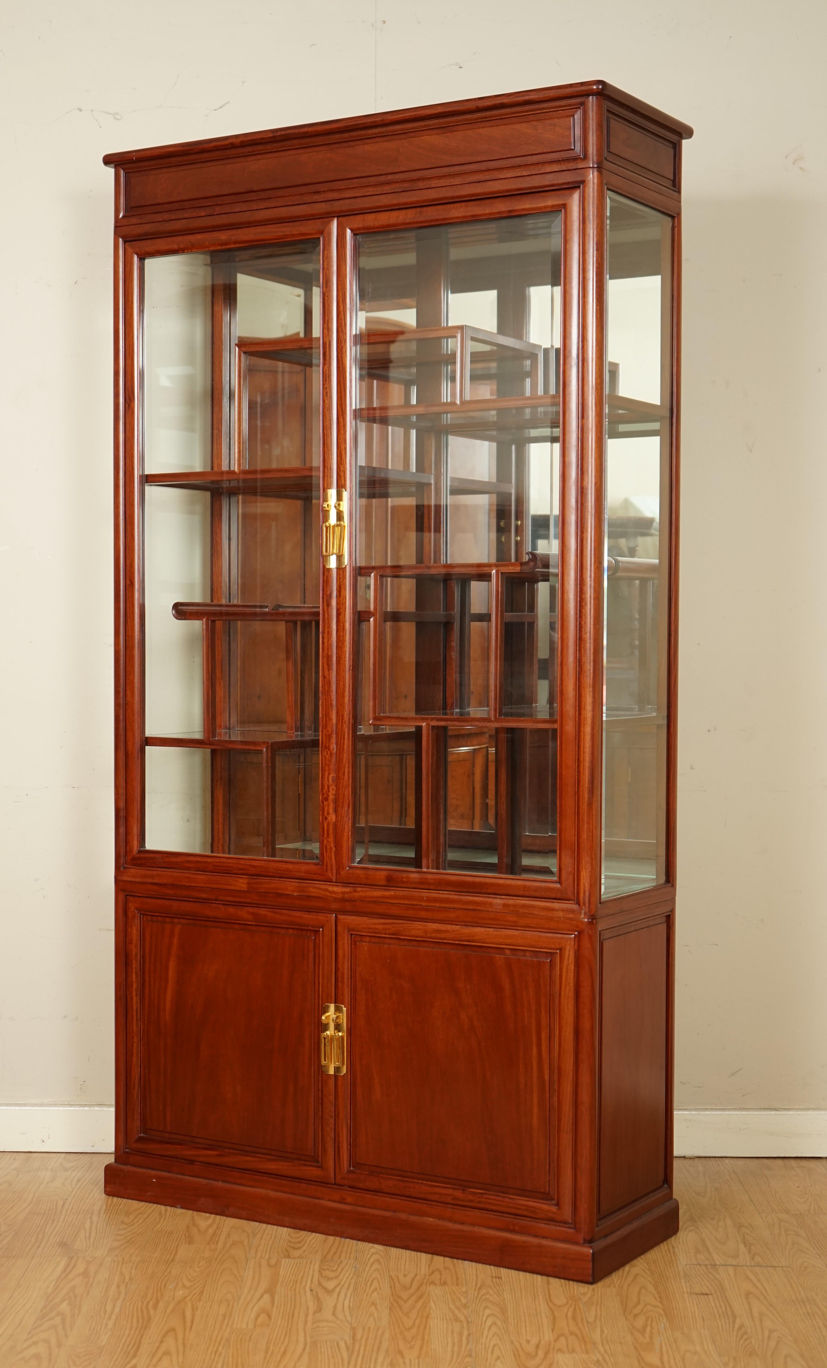 We are so excited to present to you this beautiful Oriental Chinese rosewood Curio display cabinet.

We have lightly restored this by giving it a hand clean all over, hand waxed and hand polish. 

Please carefully look at the pictures to see the