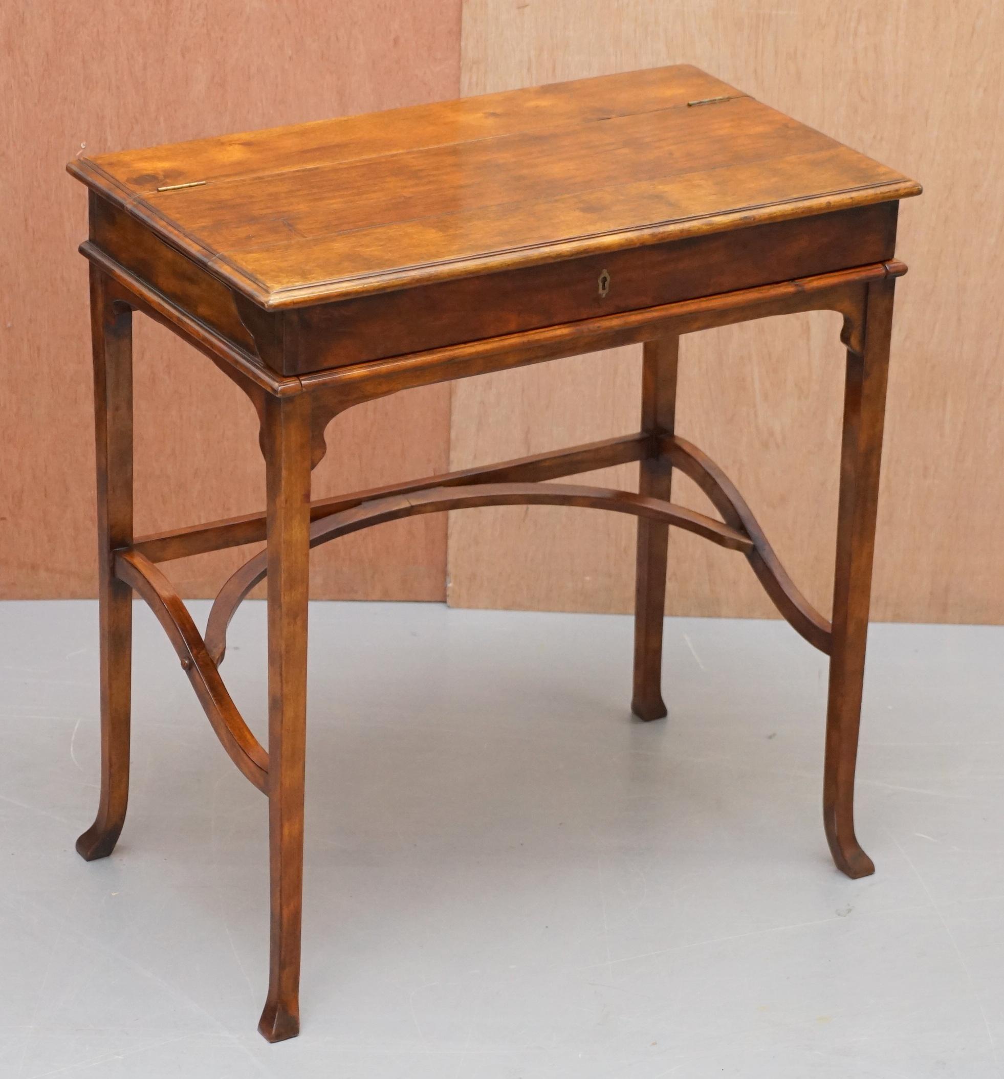 We are delighted to offer for sale this lovely Theodore Alexander Campaign desk with embossed brown leather writing surface

A good looking and well made desk, it can be used as it is or you can open the top to reveal a brown leather work top,