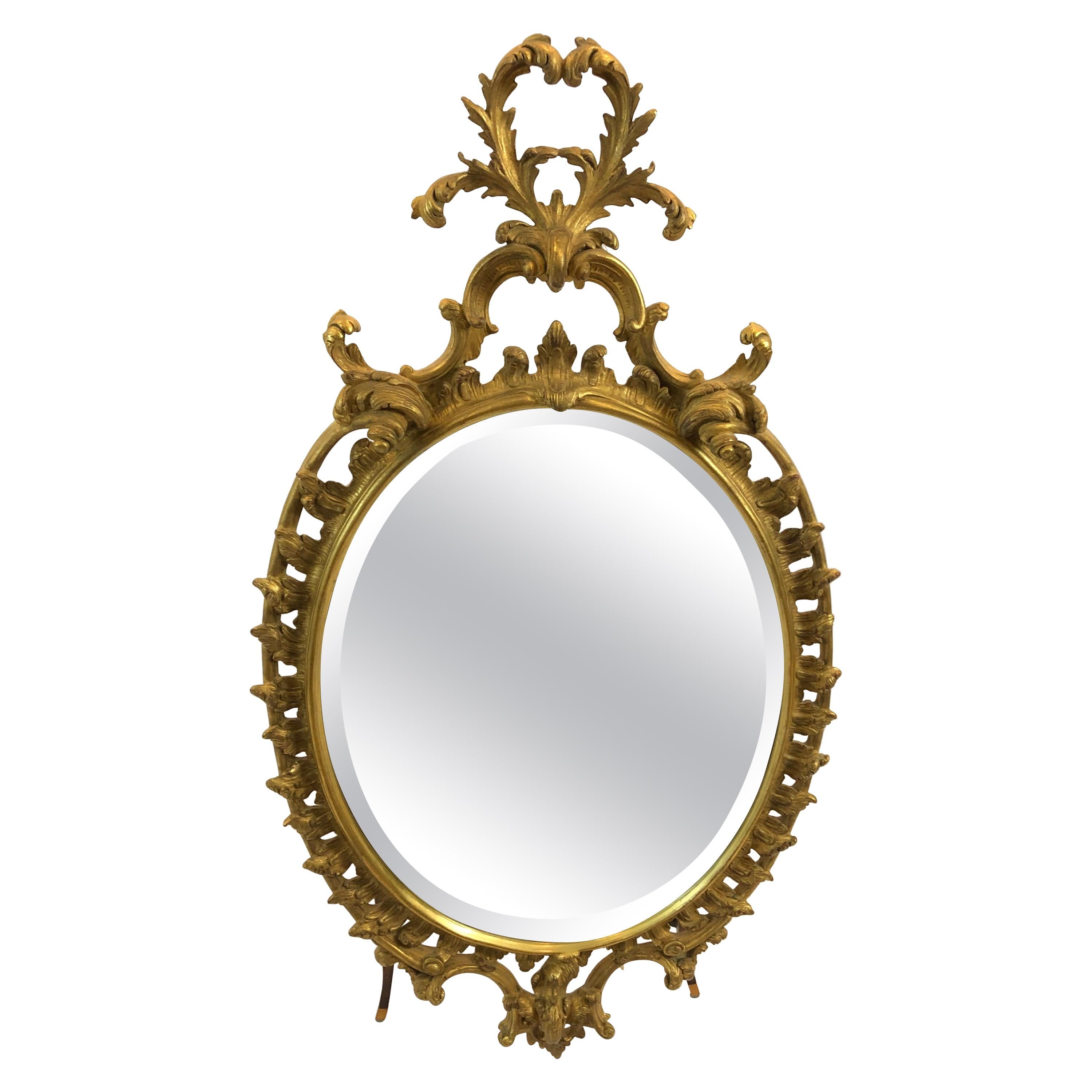 Ravissant miroir ovale en bois doré de style français