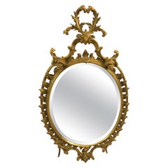 Grazioso specchio ovale in legno dorato in stile francese