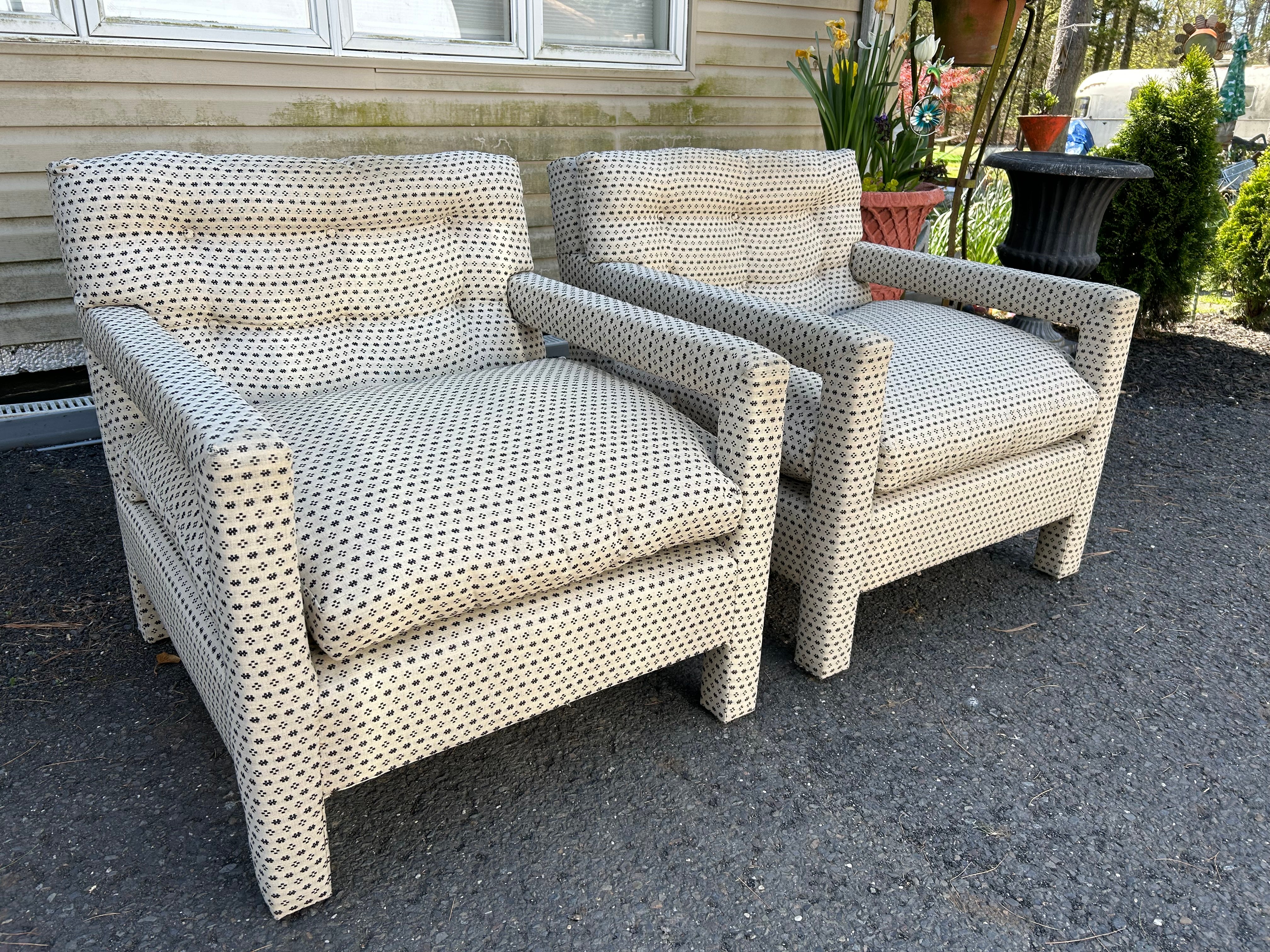 A lovely classic matching pair of fully upholstered Milo Baughman parsons chairs. Nice deep sitting comfy chairs. Upholstery has been redone in the past in a homespun woven fabric which does show a bit of wear-see photos.  The foam and padding are