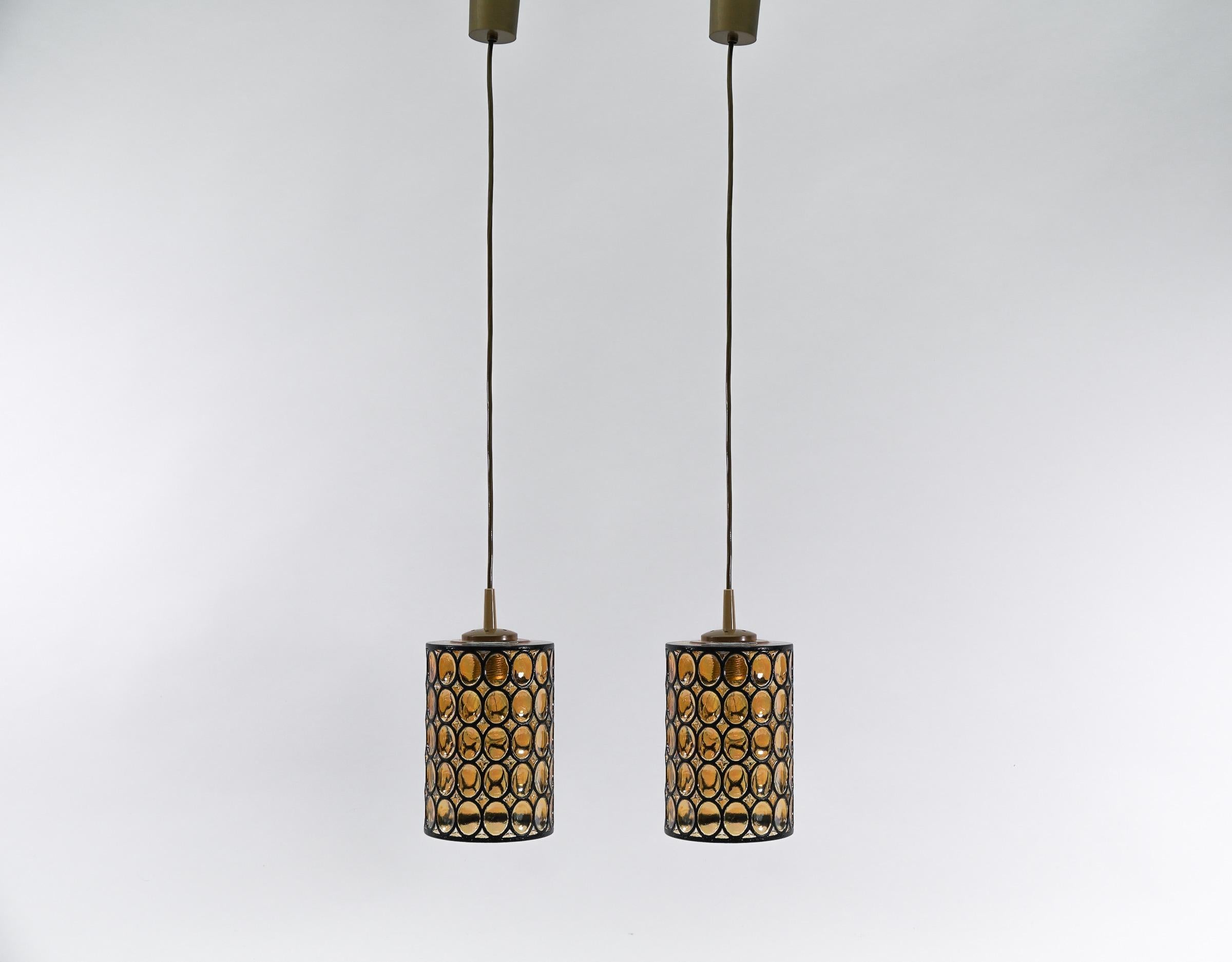 Vintage German pendant lamps in glass by Limburg. E27 socket. 

Fully functional. 

Executed in glass, each lamp needs 1 x E27 / E26 Edison screw fit bulb, is wired, in working condition and runs both on 110 / 230 volt.

Our lamps are checked,