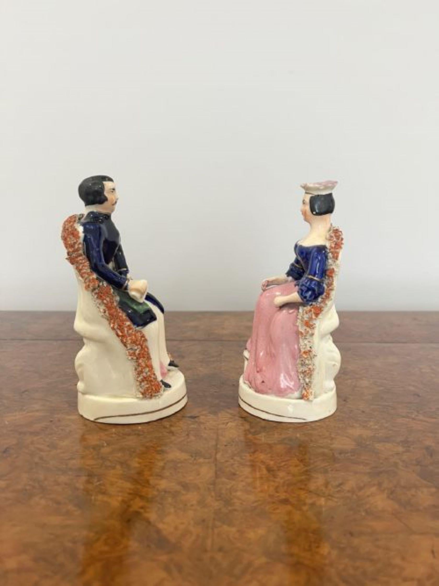 Lovely pair of antique Victorian Staffordshire 'royal' figures having a lovely pair of antique Victorian Staffordshire figures of Albert & Victoria hand painted in wonderful pink, blue, green, orange and white colours, mounted on circular gilded