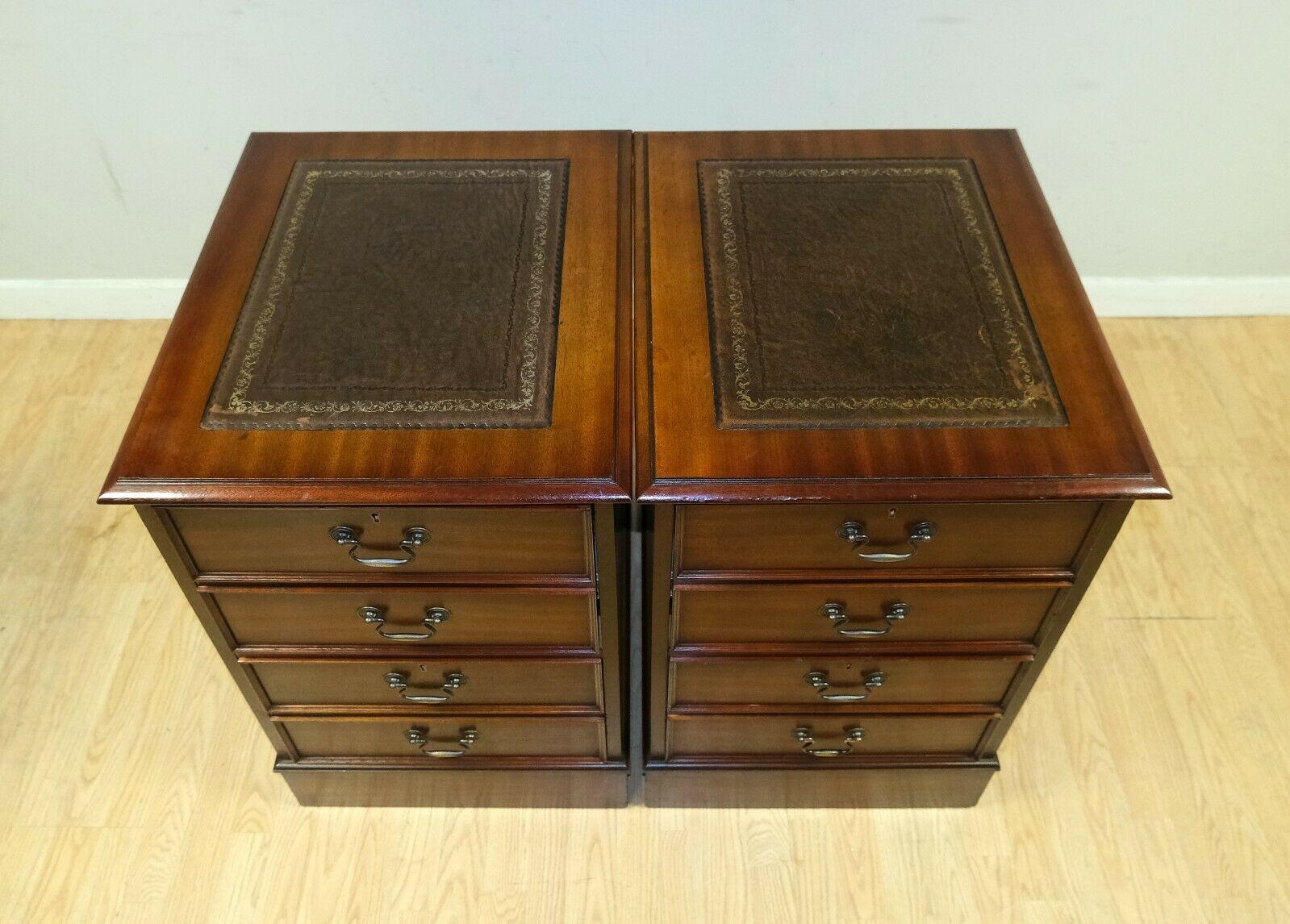 We are delighted to offer for sale this lovely pair of brown Mahogany cabinets with green leather top and gold leaf. 

This pair are a very good looking timeless pieces and very well made. The top leather and gold details make them easy to combine