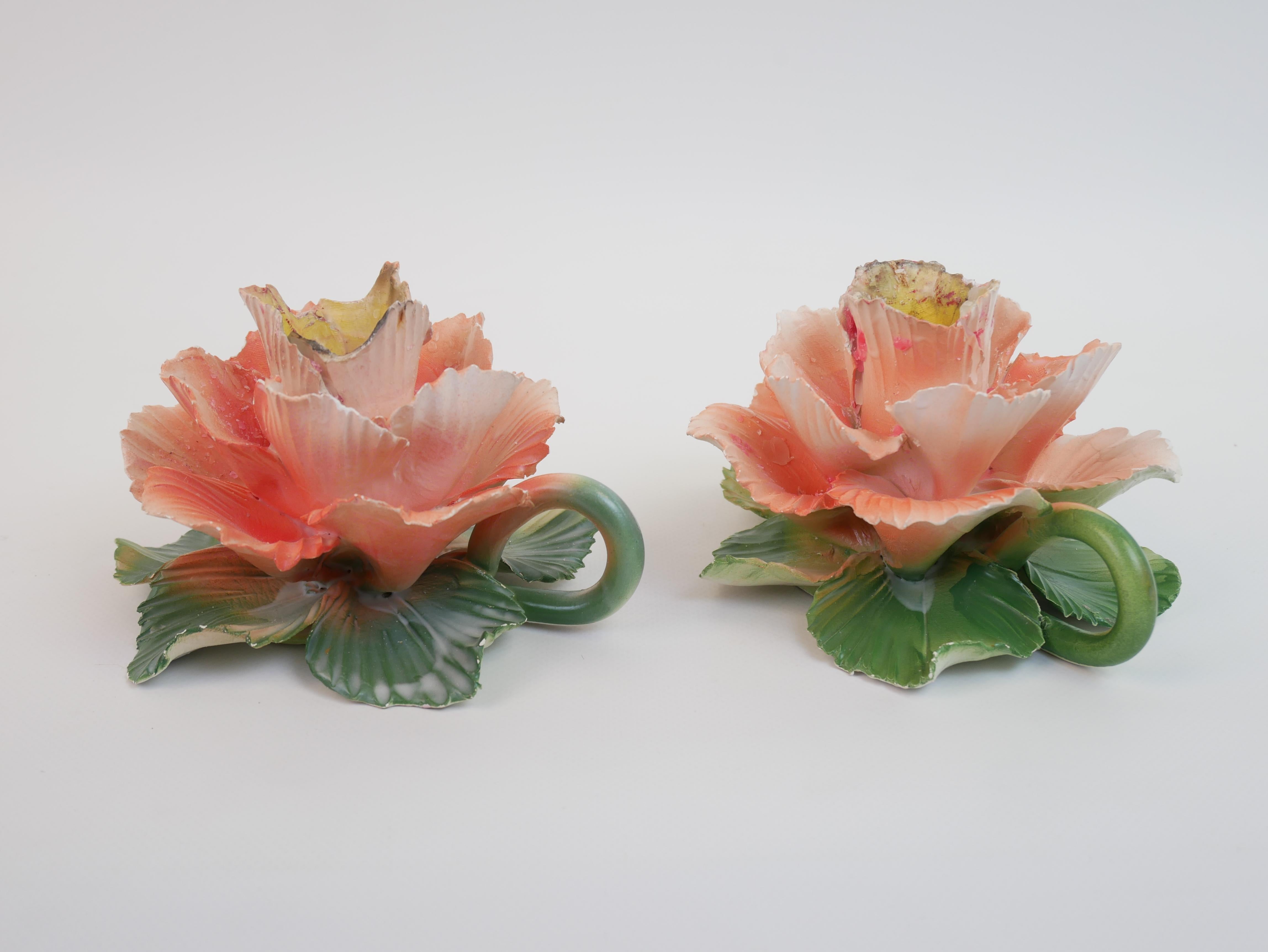 This exquisite pair of ceramic candle holders, signed 