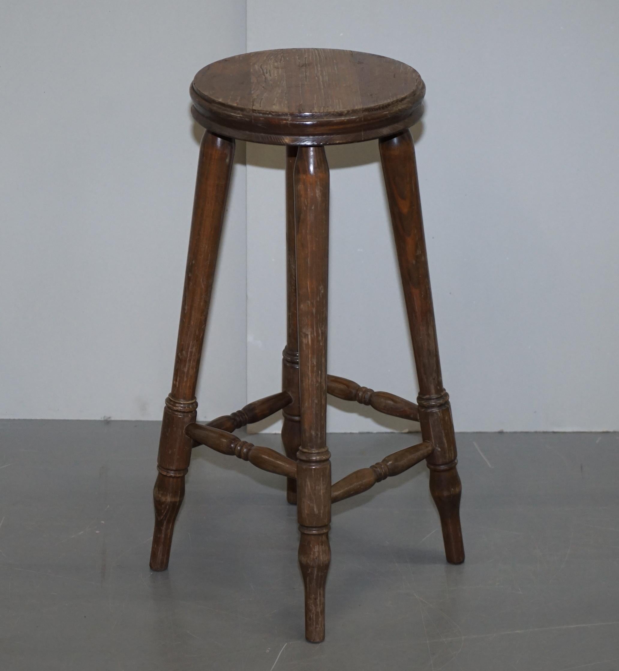 We are delighted to this lovely pair of vintage circa 1950s English oak bar stools

These are original patina stools, very nice, the wood has a lovely grain to it

We have cleaned waxed and polished them from top to bottom. They are faded and