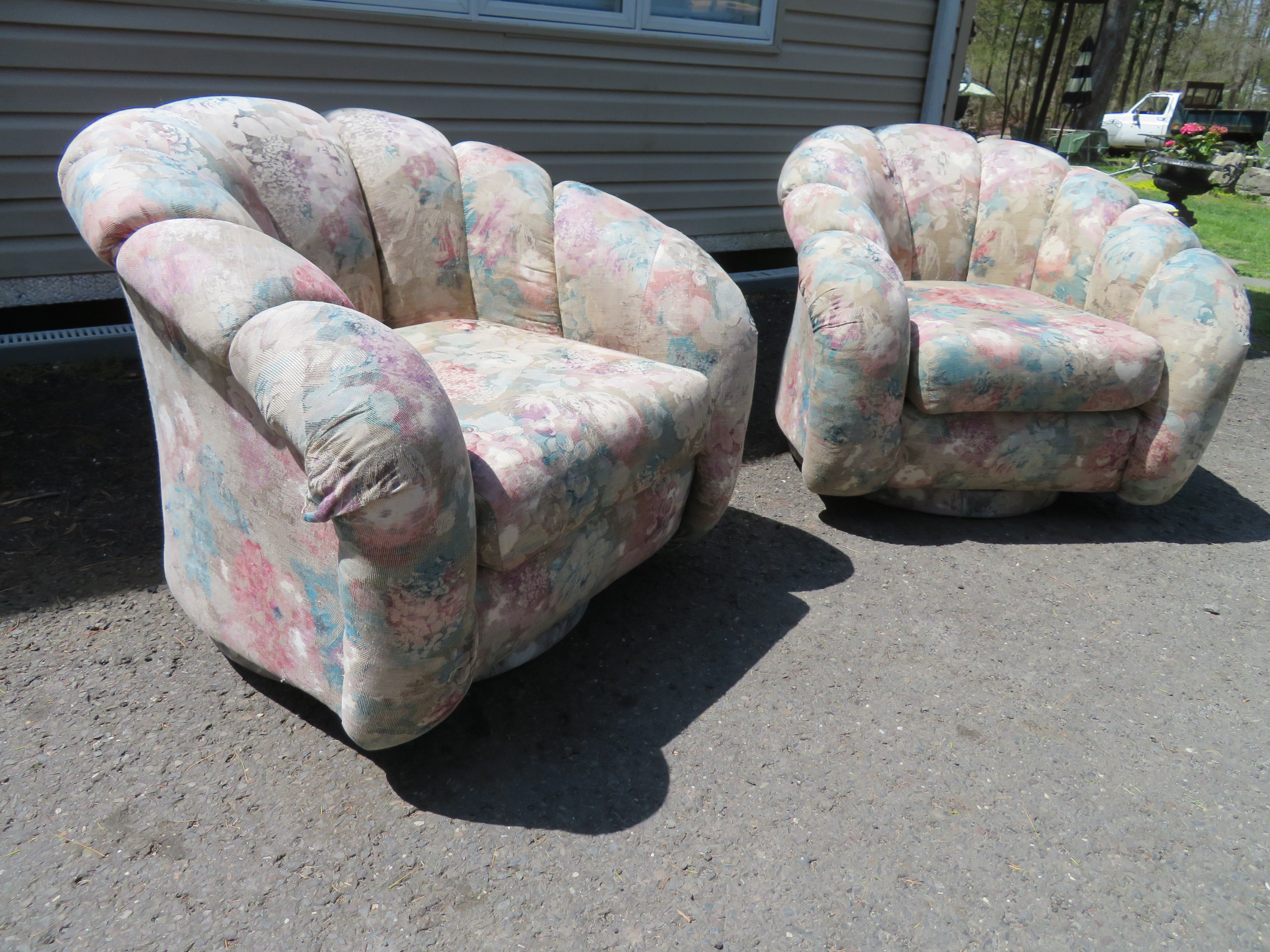 Lovely pair of Directional croissant barrel back swivel chairs. This pair will need to be reupholstered as the original fabric is worn and dated. They measure 30