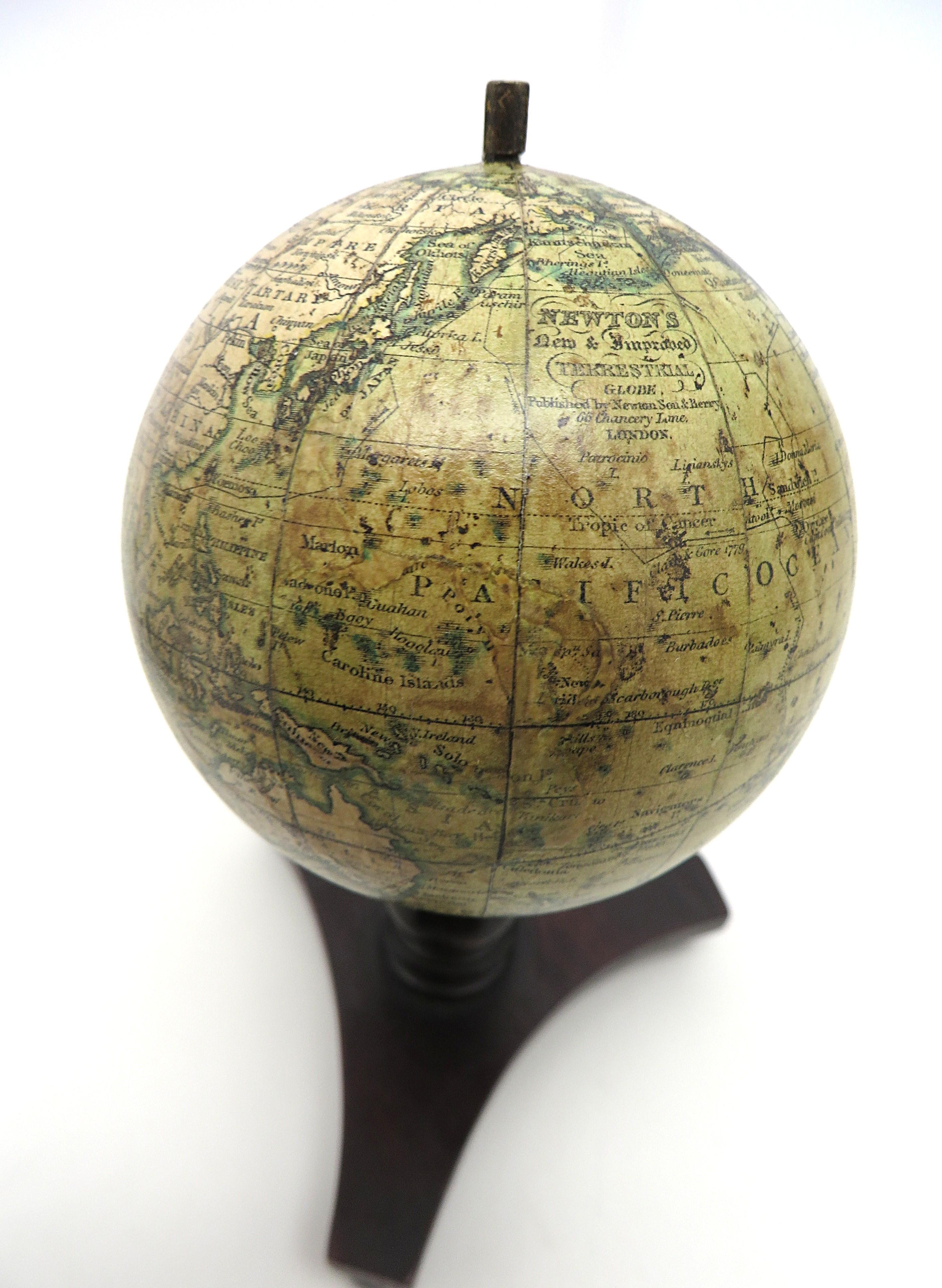 Hand-Carved Lovely pair of English miniature globes on carved wooden stands For Sale