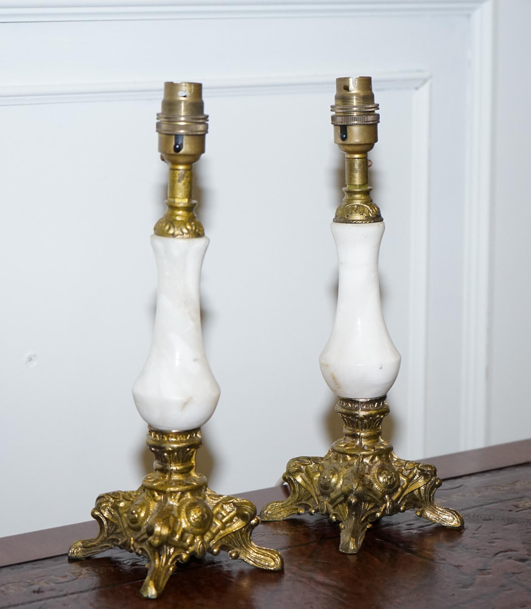 
We are delighted to offer for sale this Lovely Pair Of Vintage onyx & Gold Lamps.

 A lovely vintage pair of onyx and gold lamps is a true treasure for those who appreciate timeless beauty and exquisite craftsmanship. These lamps showcase the