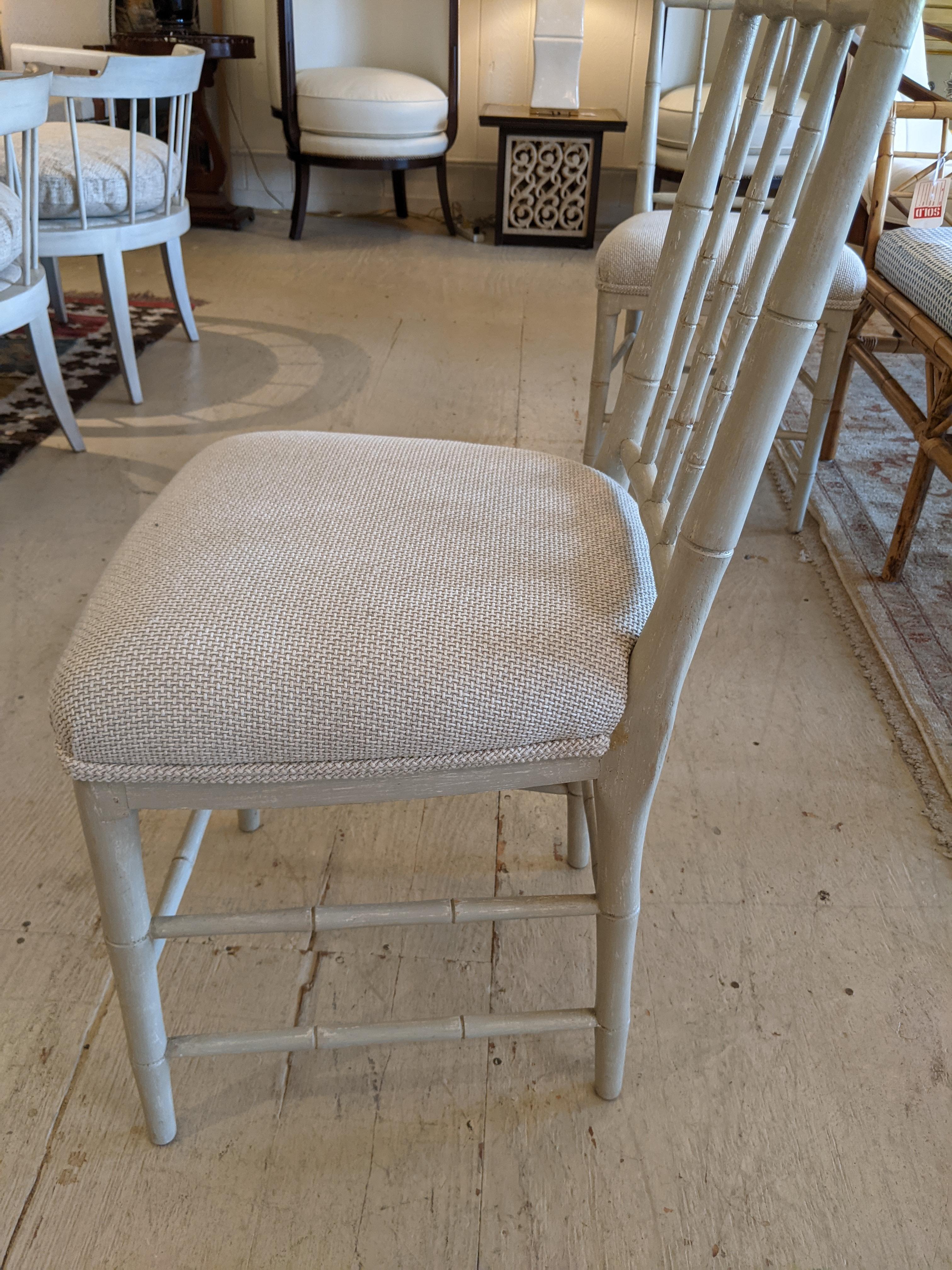 Gustavian style glazed off-white wooden small side dining chairs with compact size and cream upholstered seats. 
Note: we have 4 of this style chair with teal seats also available