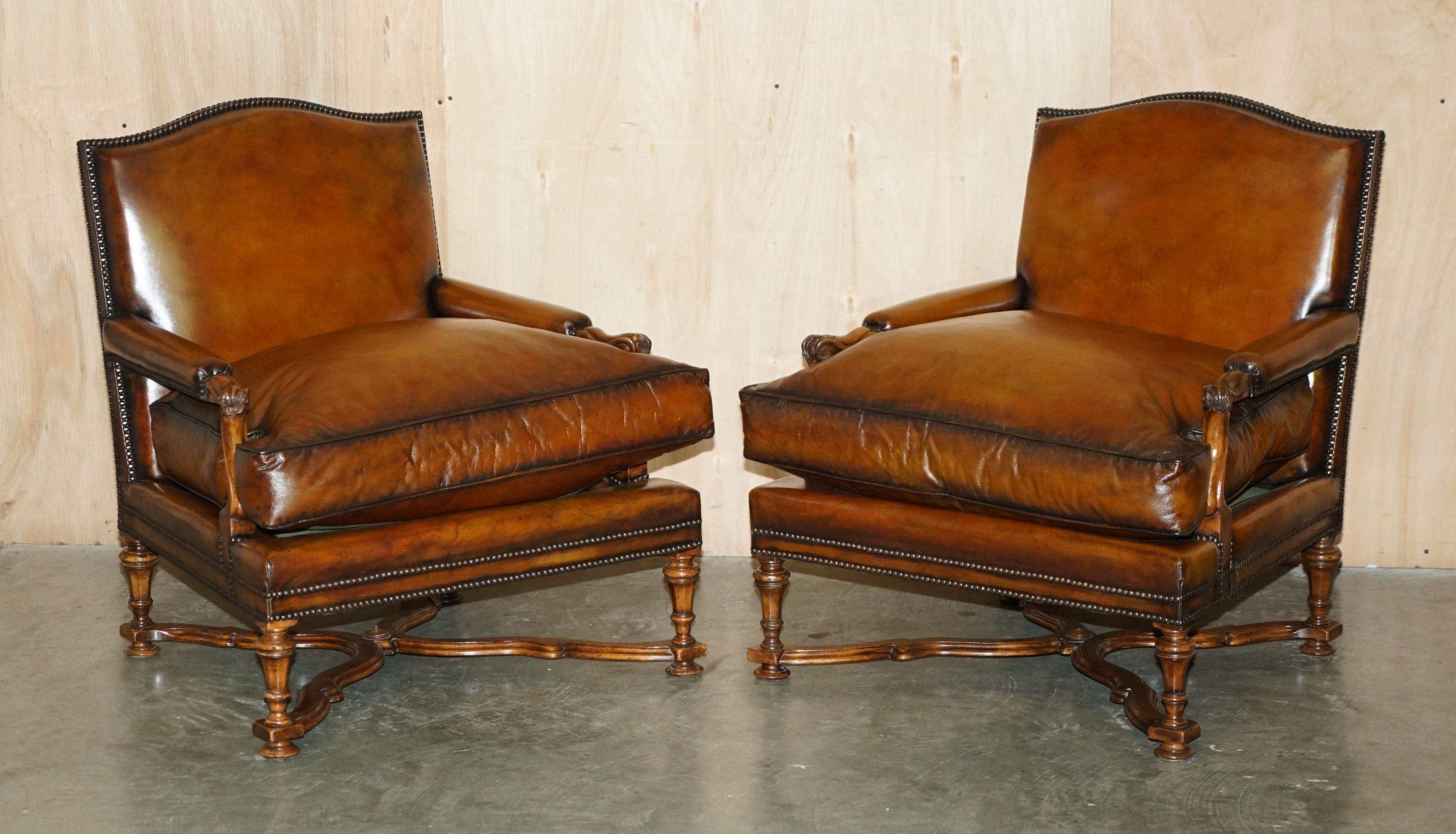 Royal House Antiques

Royal House Antiques is delighted to offer for sale this very well made pair of vintage English Library armchairs with carved Walnut frames and hand dyed brown leather upholstery complimented with a lovely large ottoman