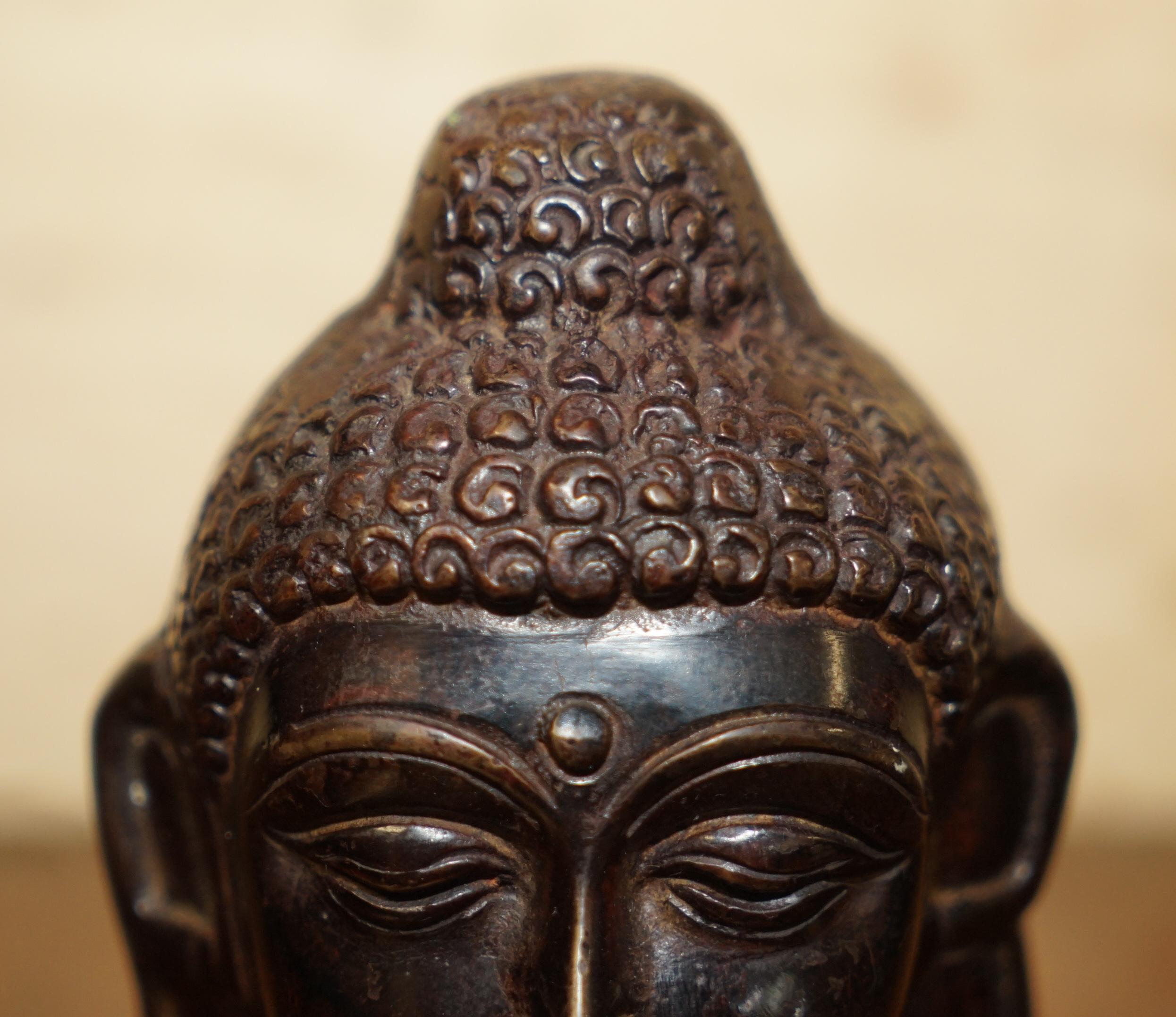 English Lovely Pair of Indonesian Bronzed Buddha Heads Very Decorative Lovely Patina For Sale