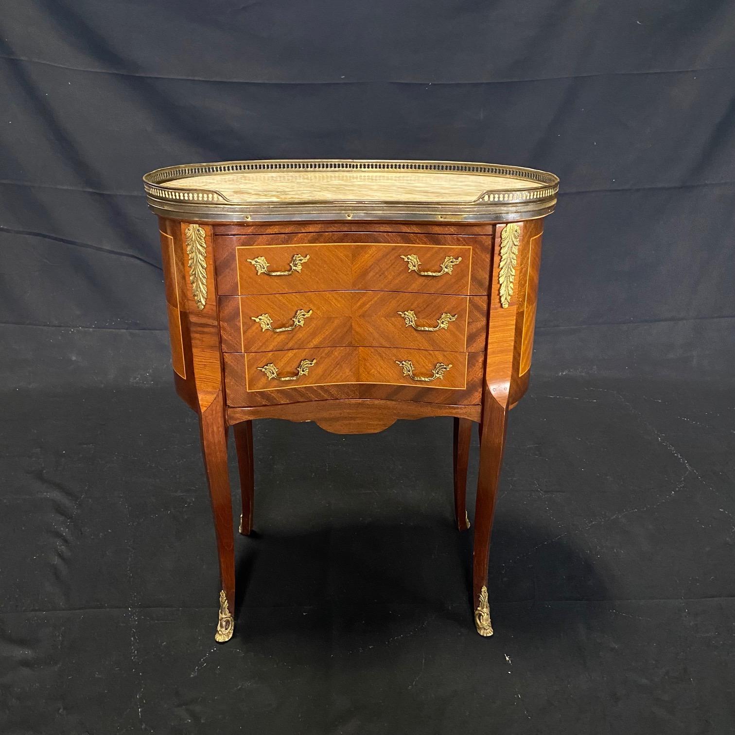 These are a pair of lovely, sophisticated night stands or mini commodes made of solid walnut with beautiful brass trim and marble tops.
#5846

 H to marble top 28”.
 