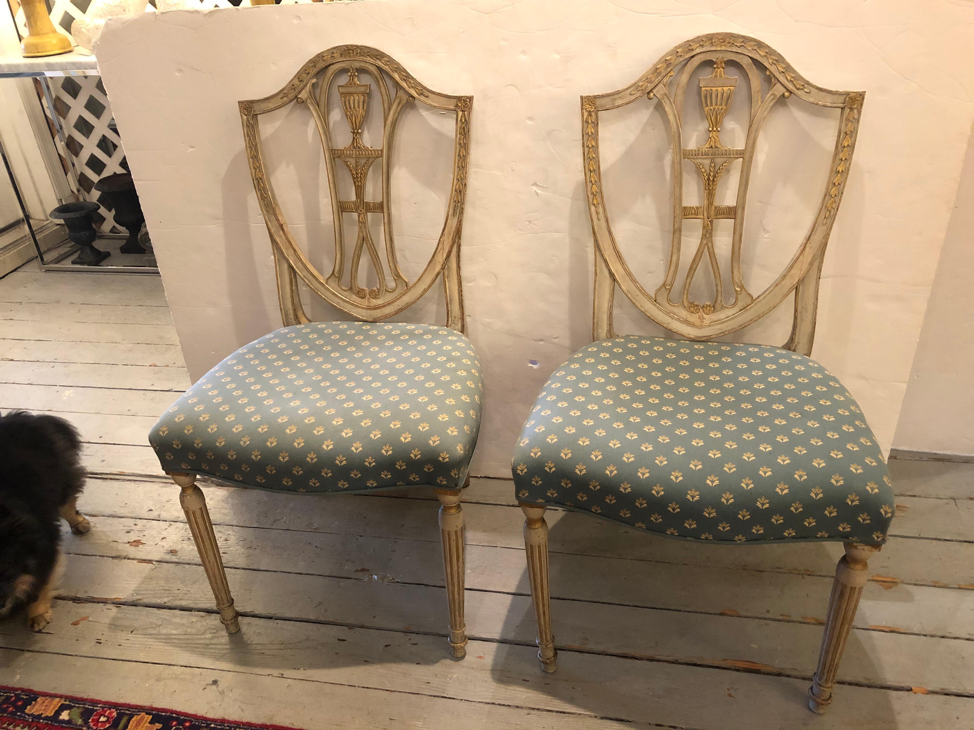 1790 French Neoclassical beautiful original grey painted side chairs with traces of old gilding, carved with acanthus leaves, wheat and urns.  Reeded legs.  