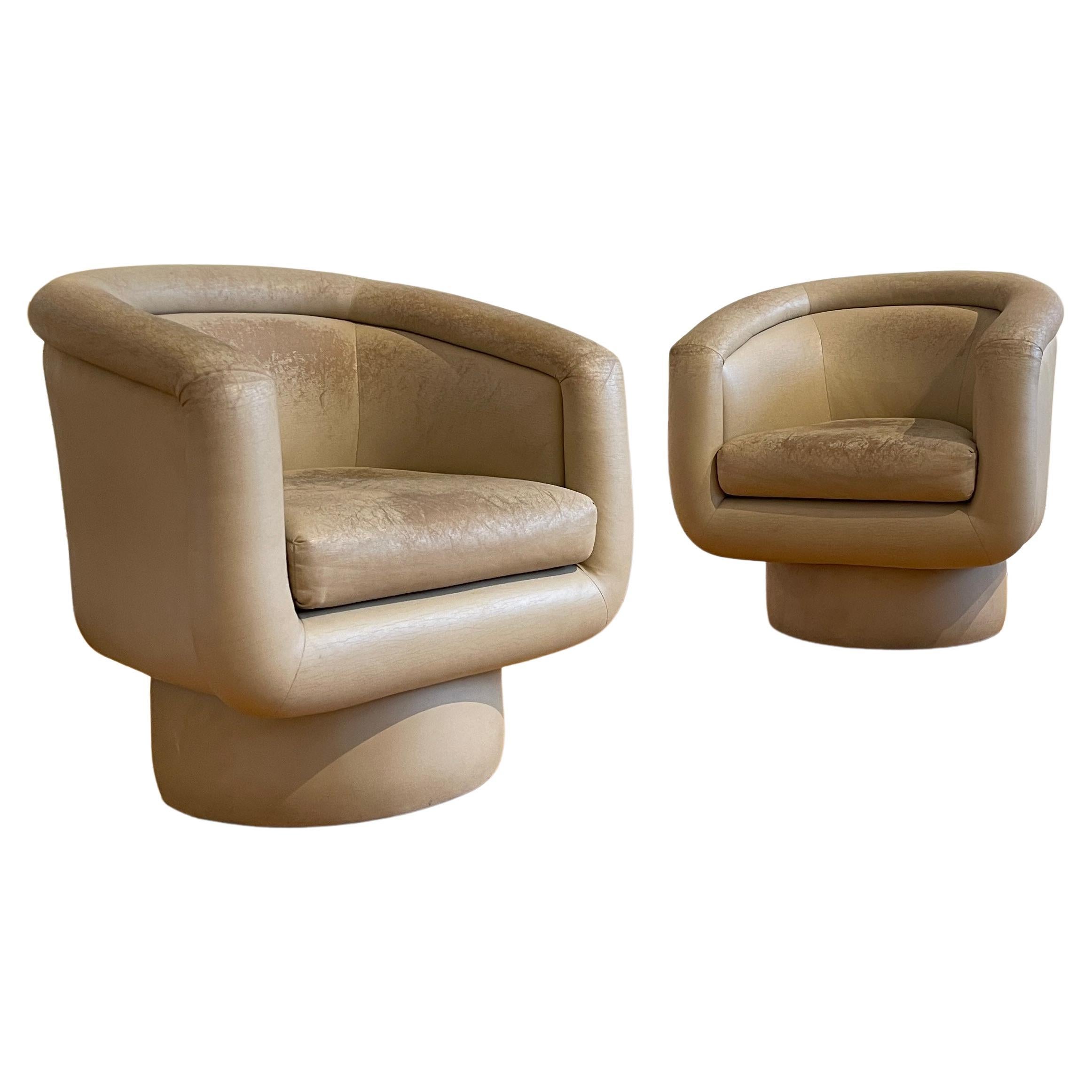 Absolutely stunning pair of postmodern swivel chair. Great comfortable height with a smooth 360 degree swivel. Upholstery has a really great looking patina and foam is good so the chairs could definitely be used as they are.