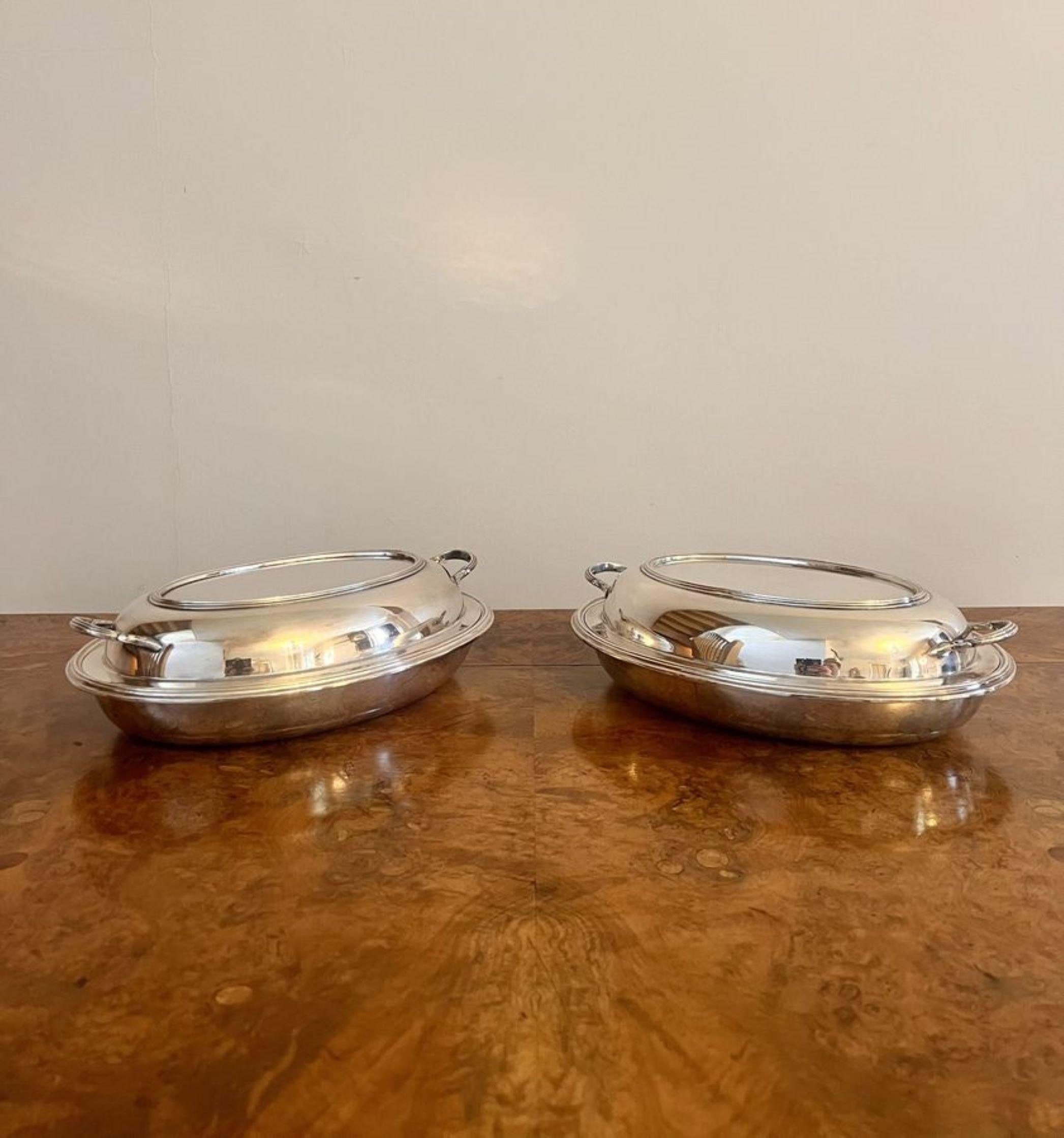 Lovely pair of quality antique Edwardian silver plated entree dishes, having a quality pair of oval shaped entree dishes with removable lids and shaped twin handles to the sides.  

D. 1900