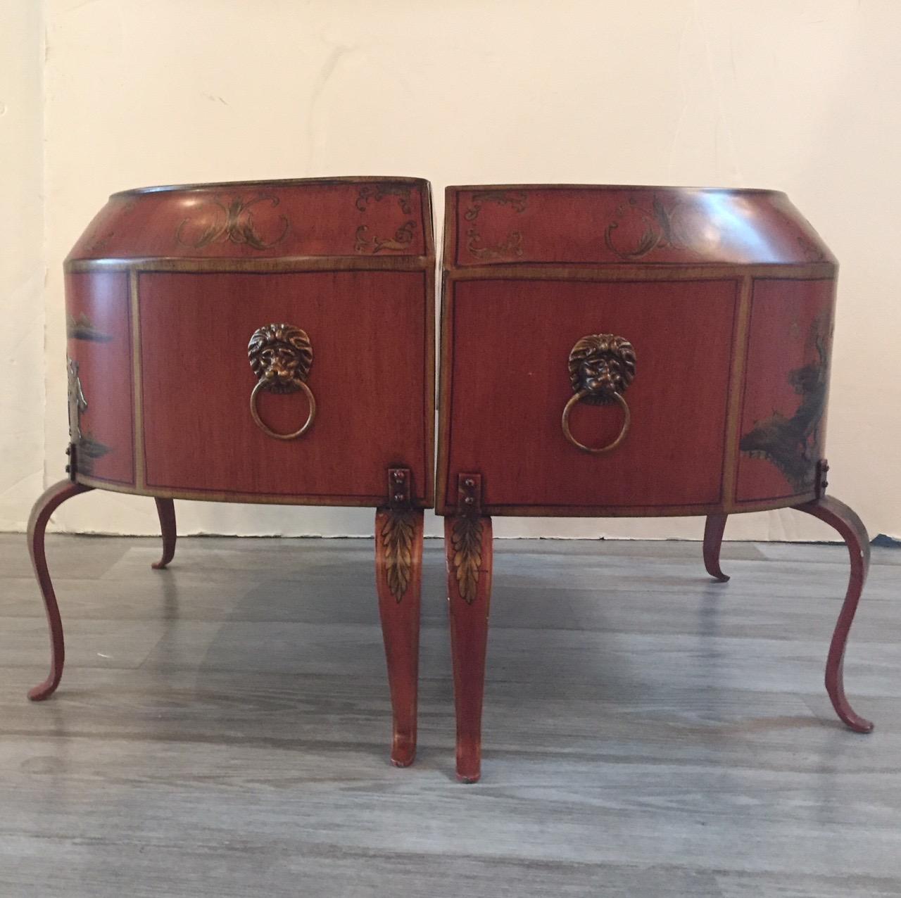 Italian hand-painted pair of red tole planters decorated with chinoiserie scenes in gold and black. Great brass hardware and cabriole legs.
 