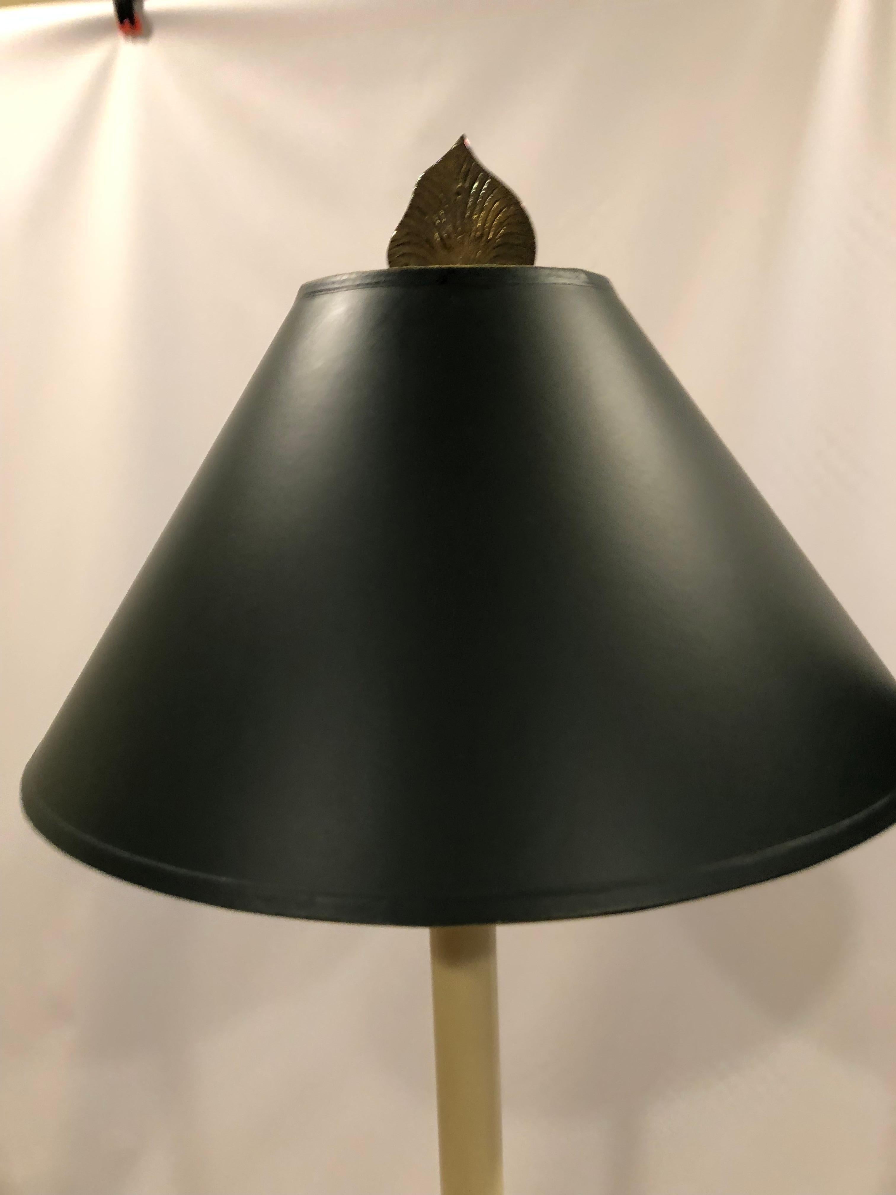 Elegant tall brass table lamps having stunning triangular shaped bases with dolphins. Measures: bases are 8.5