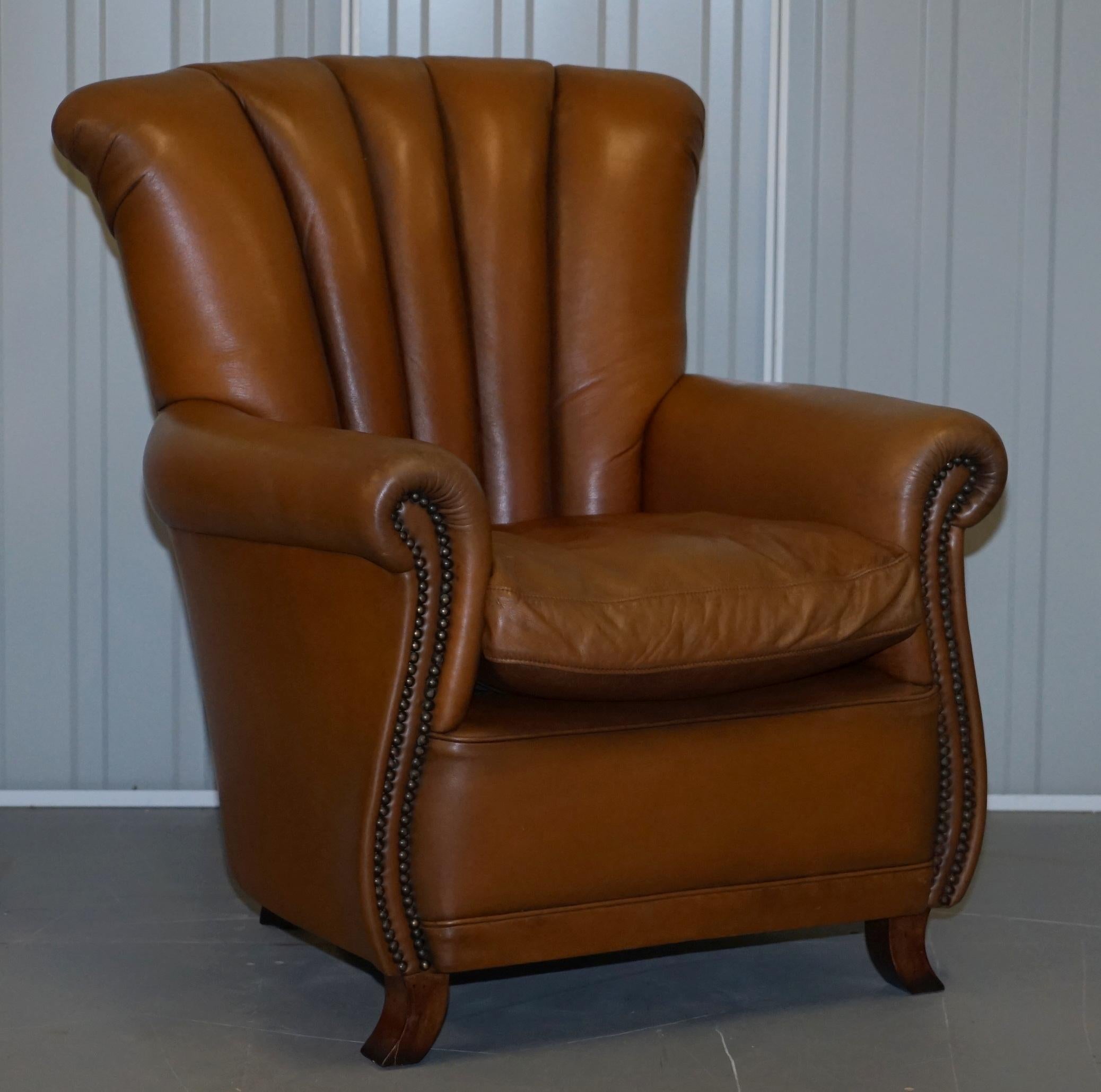 We are delighted to this lovely pair of Art Deco style Tetrad Ella aged tan brown leather armchairs

These are one of my favorite armchairs, they sit like a large club chair but they are very small and compact. The cushions nice and medium soft