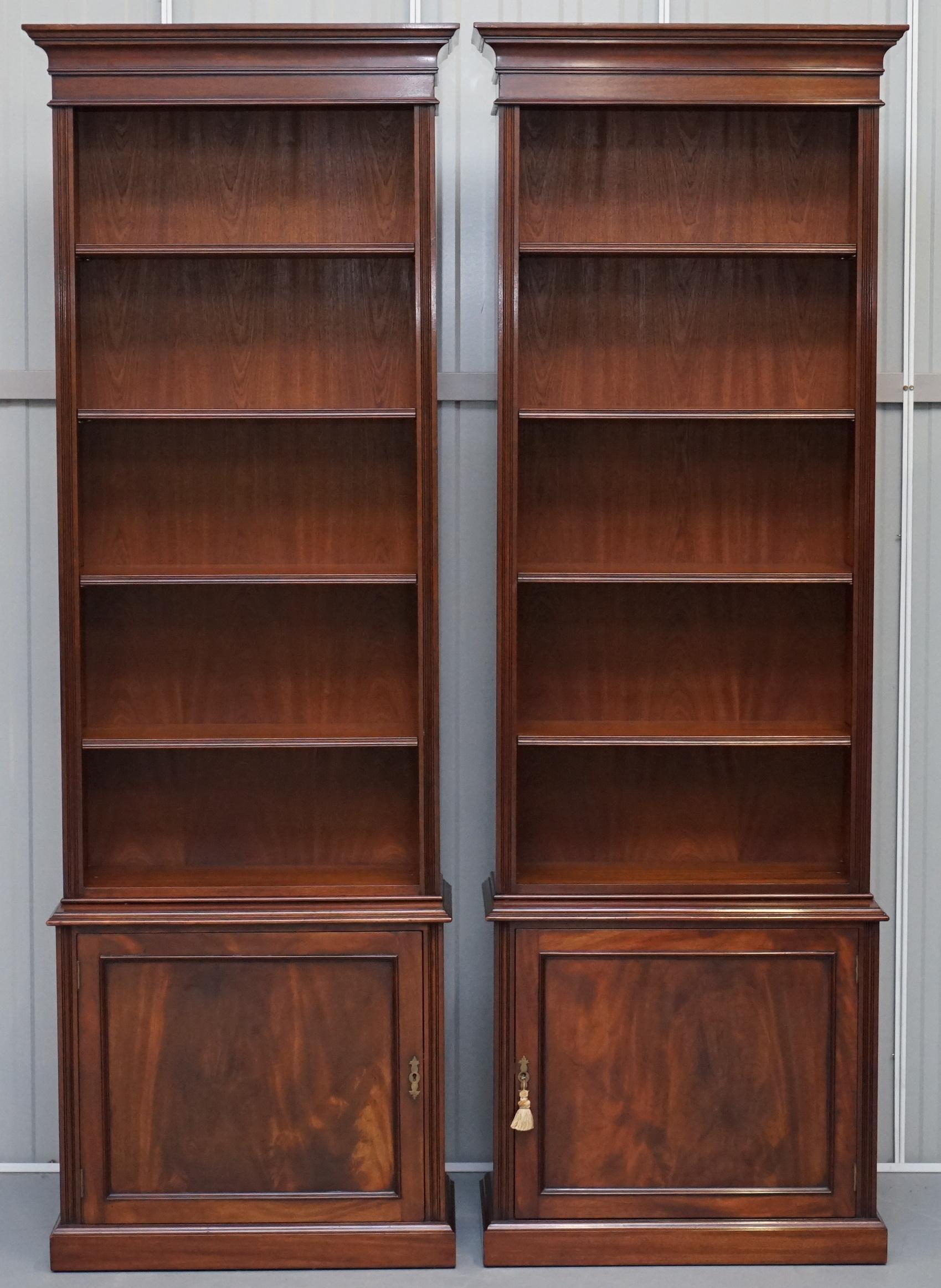 We are delighted to this exquisite pair of vintage luxury flamed mahogany library bookcases with cupboard bases

A very good looking and utilitarian pair, ideal for a narrow space perhaps either side of a fireplace. These are good honest tall