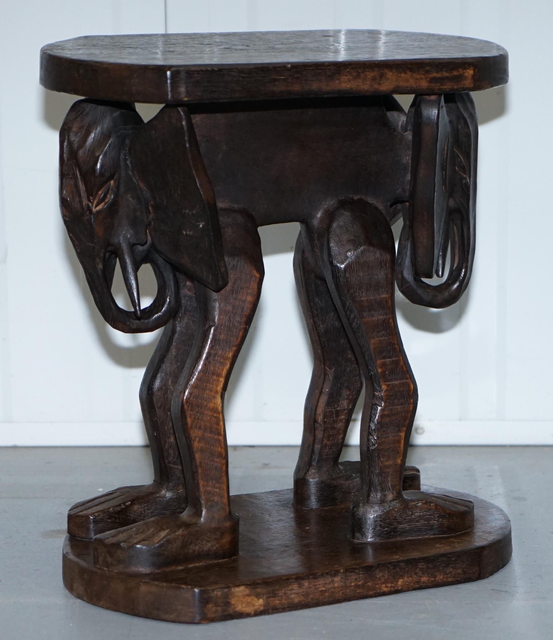 We are delighted to offer for sale this very naively carved pair of small safari side tables depicting Elephants

These tables are hand carved, the timber is totally solid, they make nice decorative side tables. The carving is very Primitive as