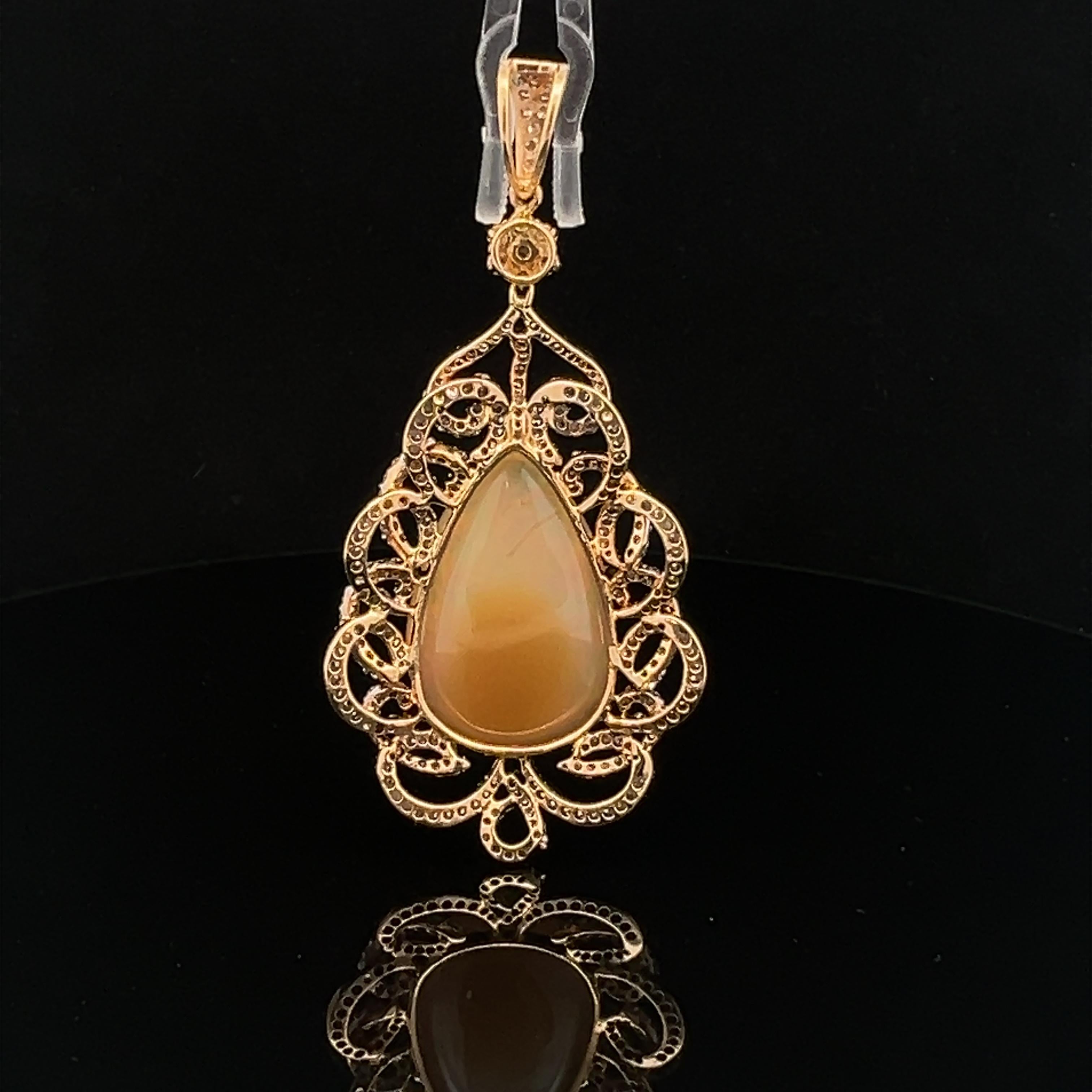 Lovely pendant made of natural opal and diamonds in gold. For Sale 1