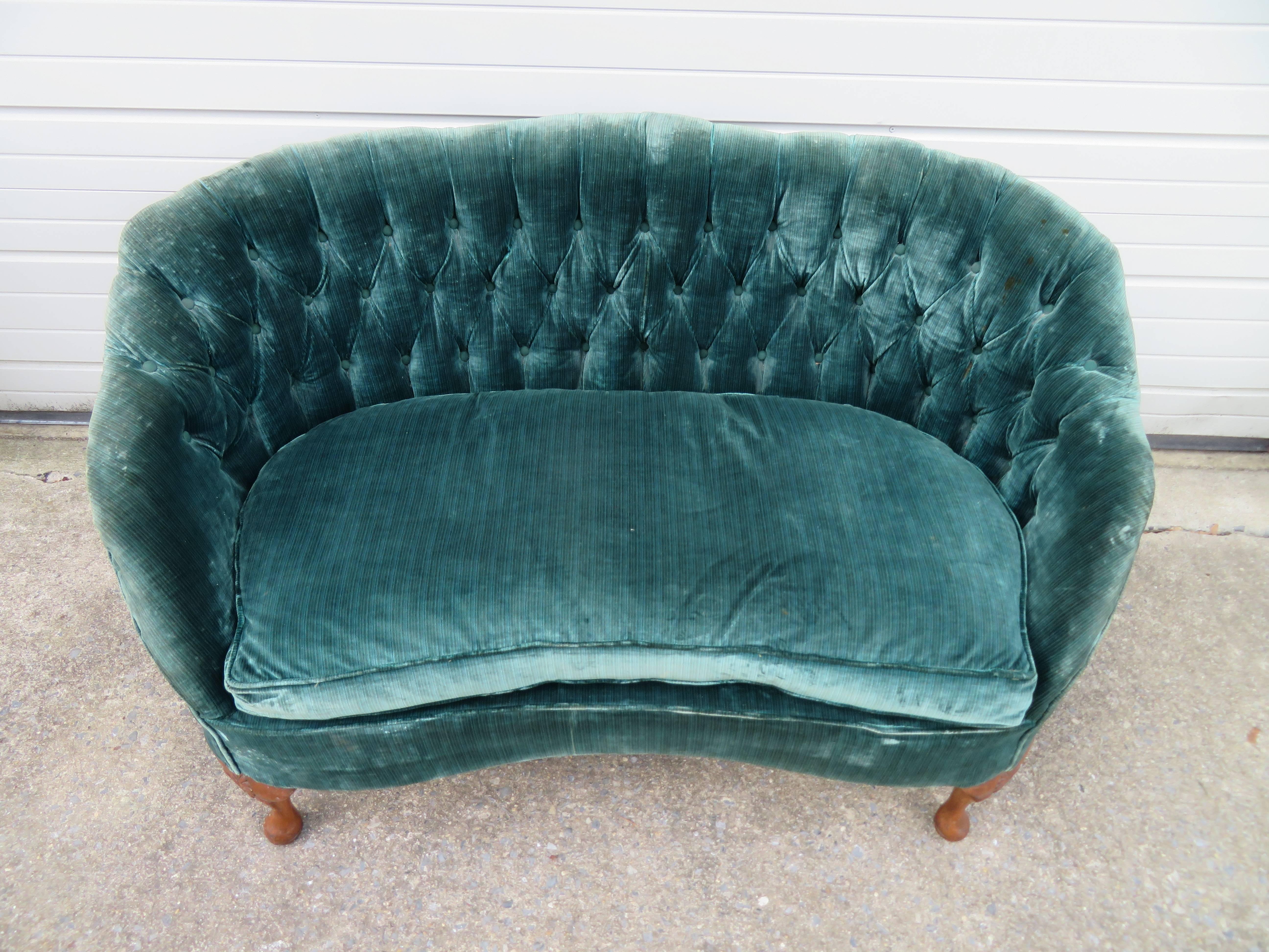 Lovely petite Hollywood Regency tufted loveseat with a down filled lose seat cushion. This piece will definitely need to be re-upholstered but that's what you designers are looking for -right?